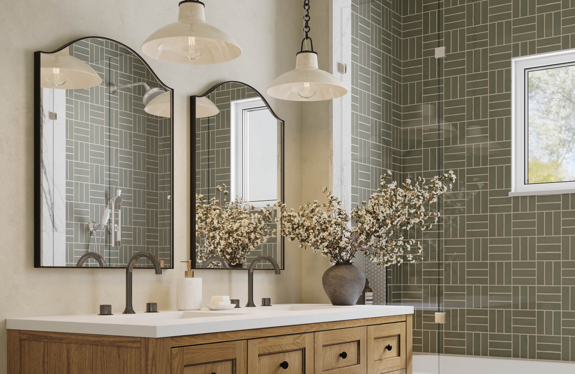null Bathroom with twin arched black-framed mirrors above a wood double vanity, featuring green geometric wall tiles and blooming branch decor.