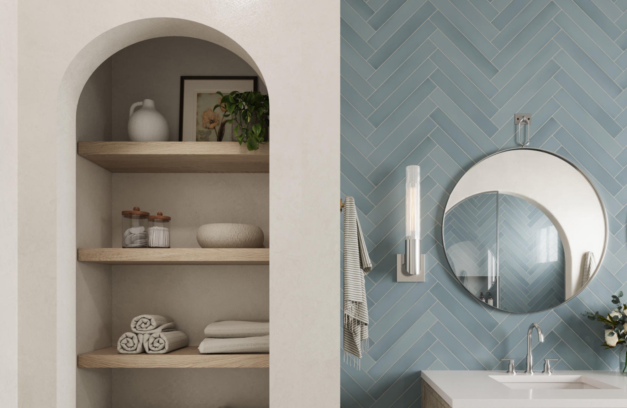 Round mirror against blue herringbone tile, adding geometric contrast to soften linear patterns in a modern bathroom.
