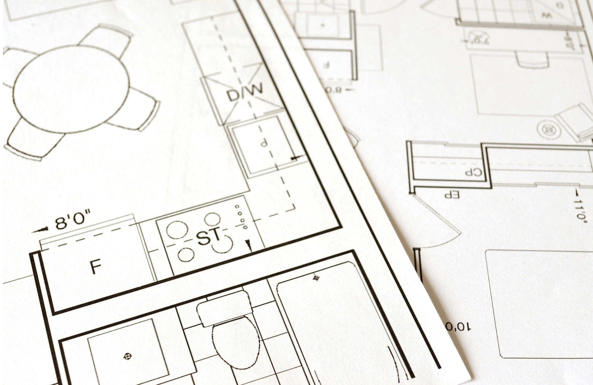 null Bathroom renovation plans laid out on paper, highlighting layout decisions and measurement planning.