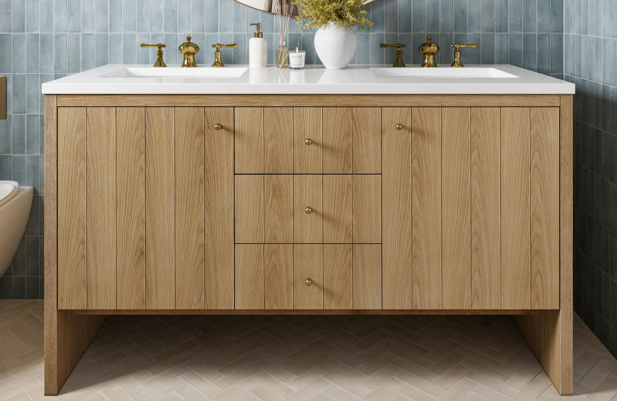 null Minimalist oak vanity with vertical wood grain, brass hardware, and dual sinks, set against glossy blue tile walls.