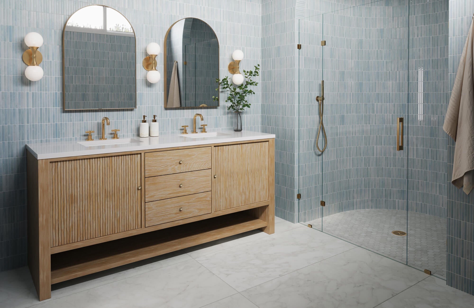 Bright bathroom with light blue vertical backsplash tiles, dual mirrors, and blonde wood vanity with white countertop.