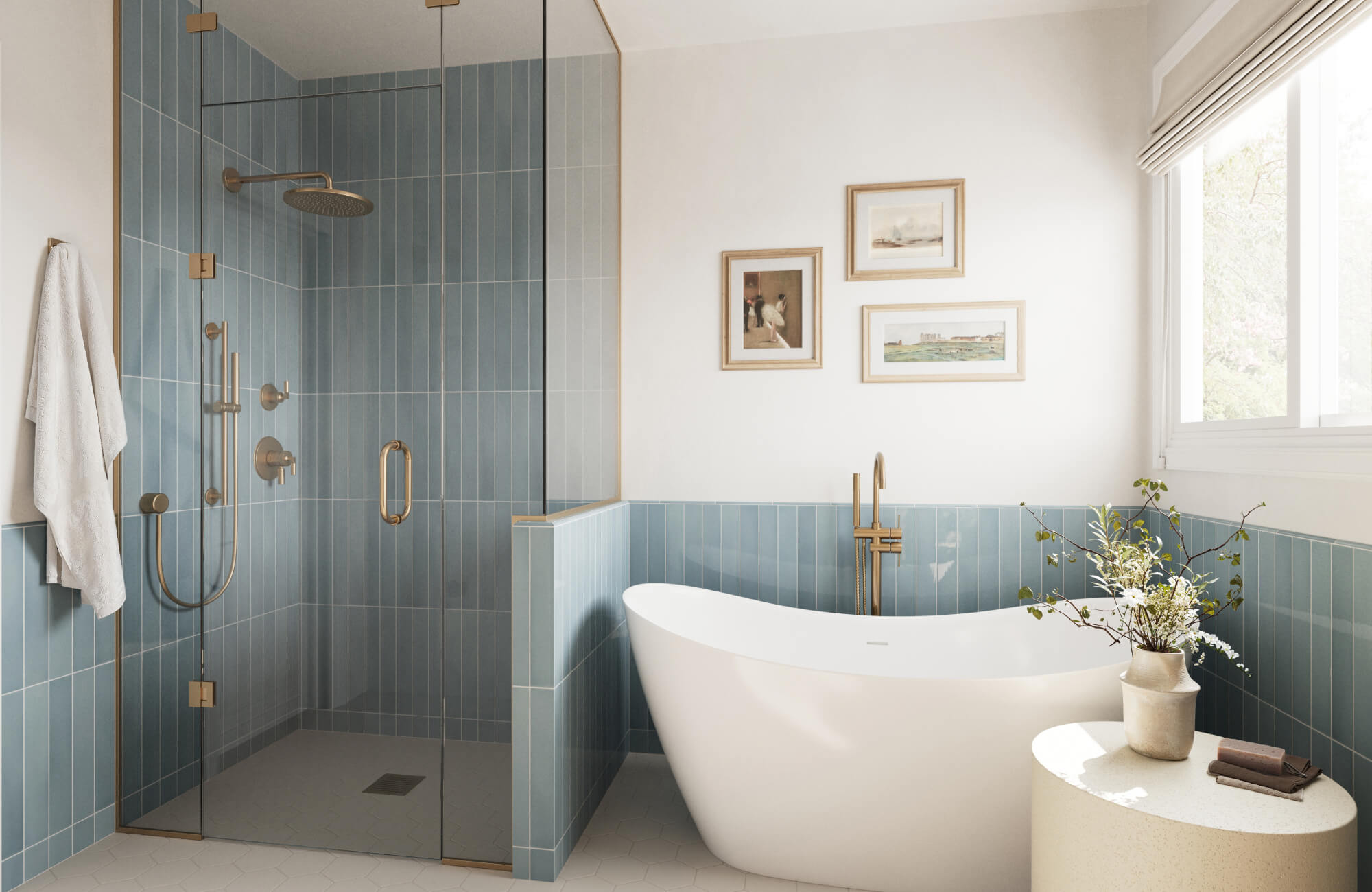 Serene bathroom with soft blue vertical backsplash tiles, white soaking tub, and brass fixtures near a sunlit window.