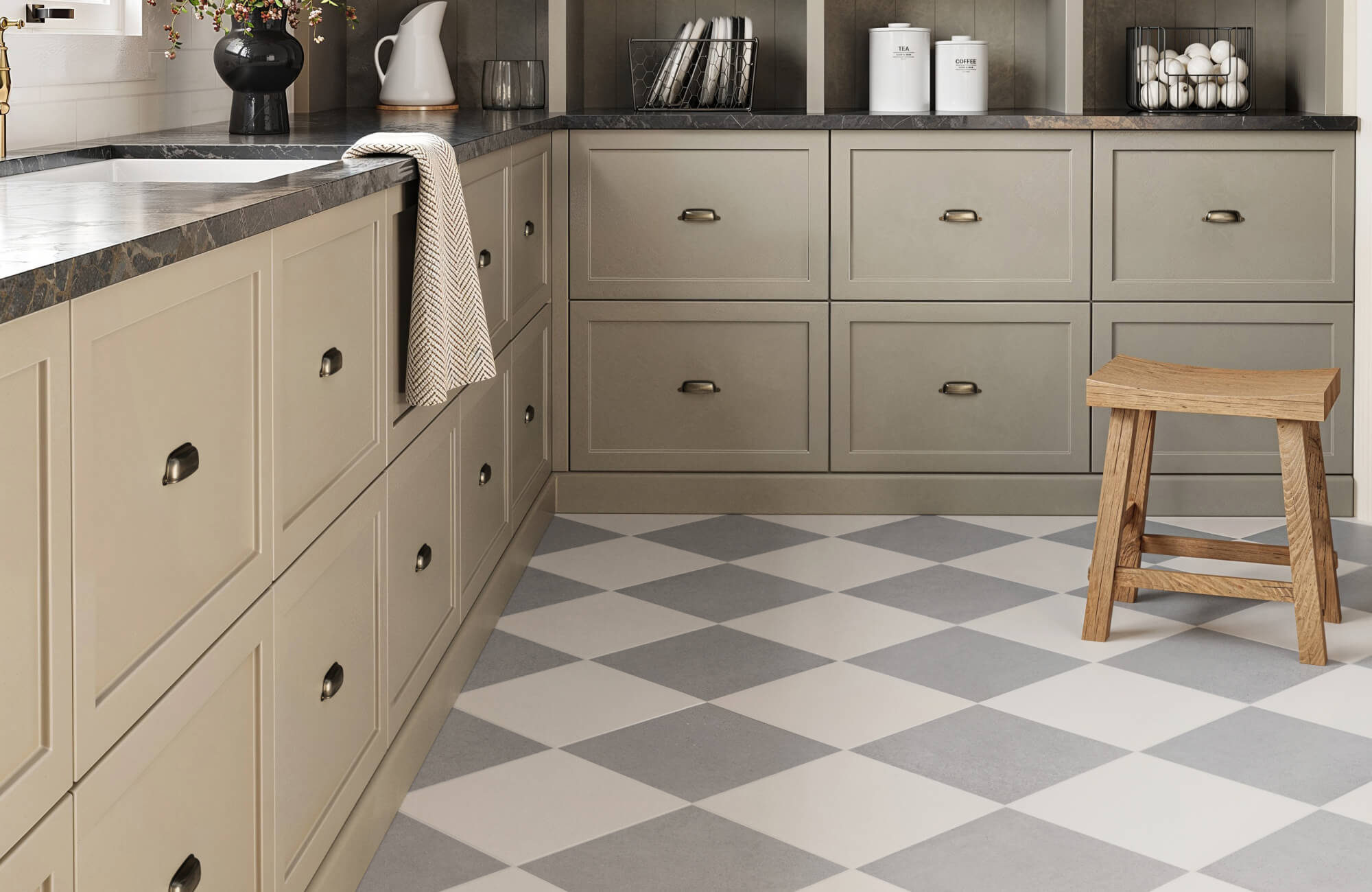 null Traditional kitchen with taupe cabinets, a dark stone countertop, and soft gray-and-white checkered floor tiles, creating a cozy, rustic ambiance.