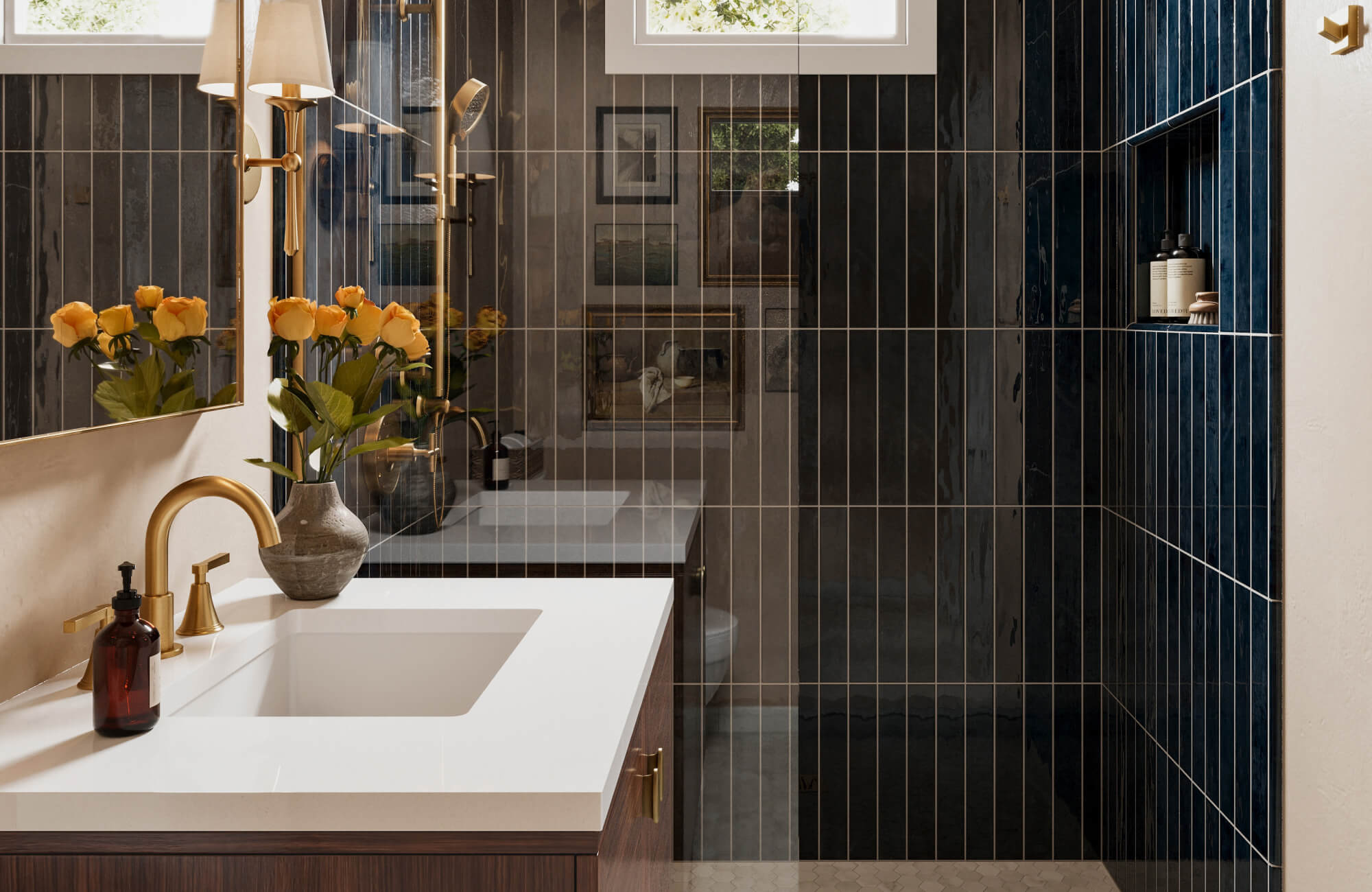 Modern bathroom with glossy vertical subway tiles in a straight lay pattern, featuring deep blue and charcoal tones with brass fixtures.