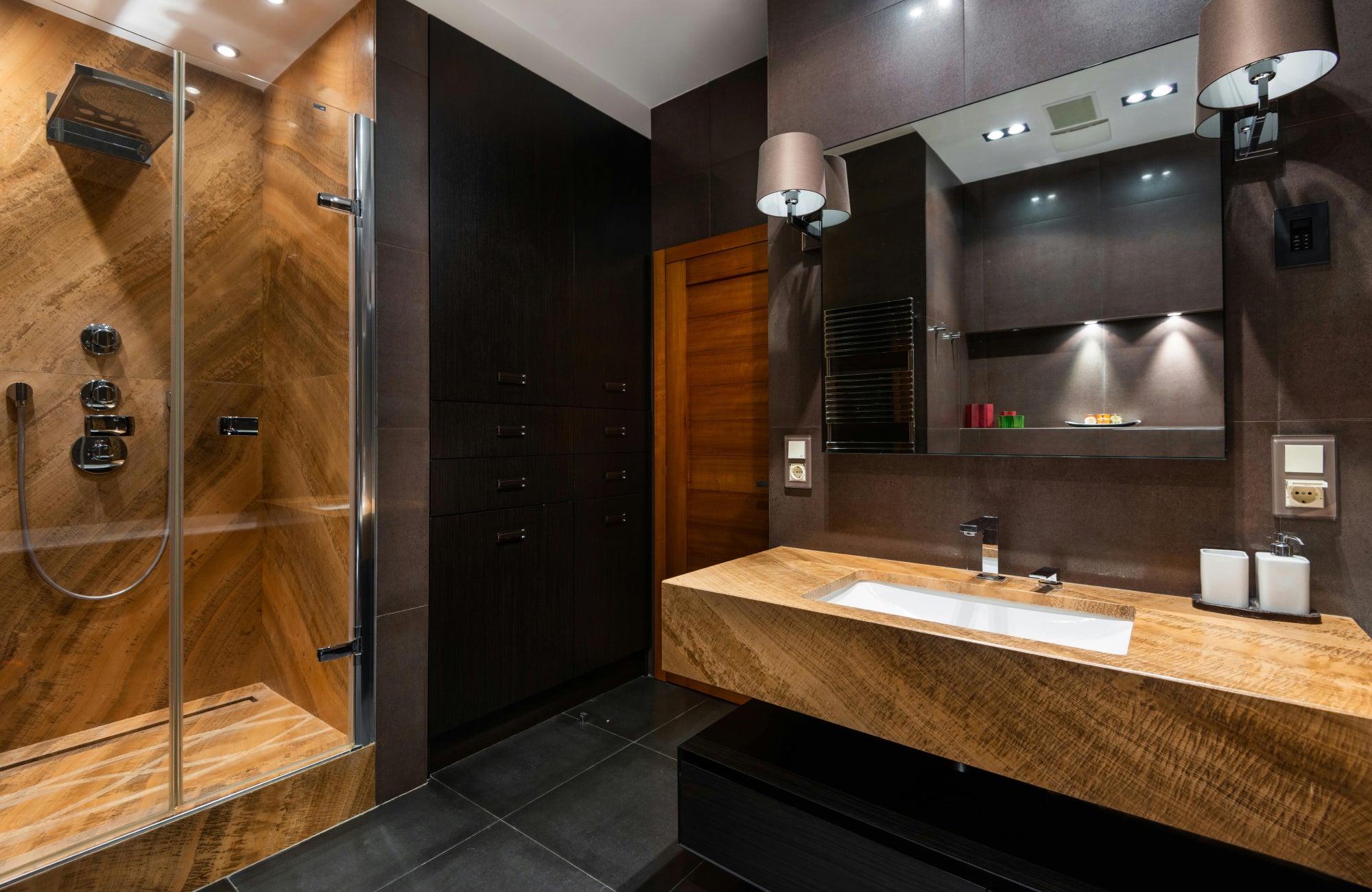 null Contemporary bathroom featuring a floating wood vanity with a sleek rectangular sink and large wall mirror.