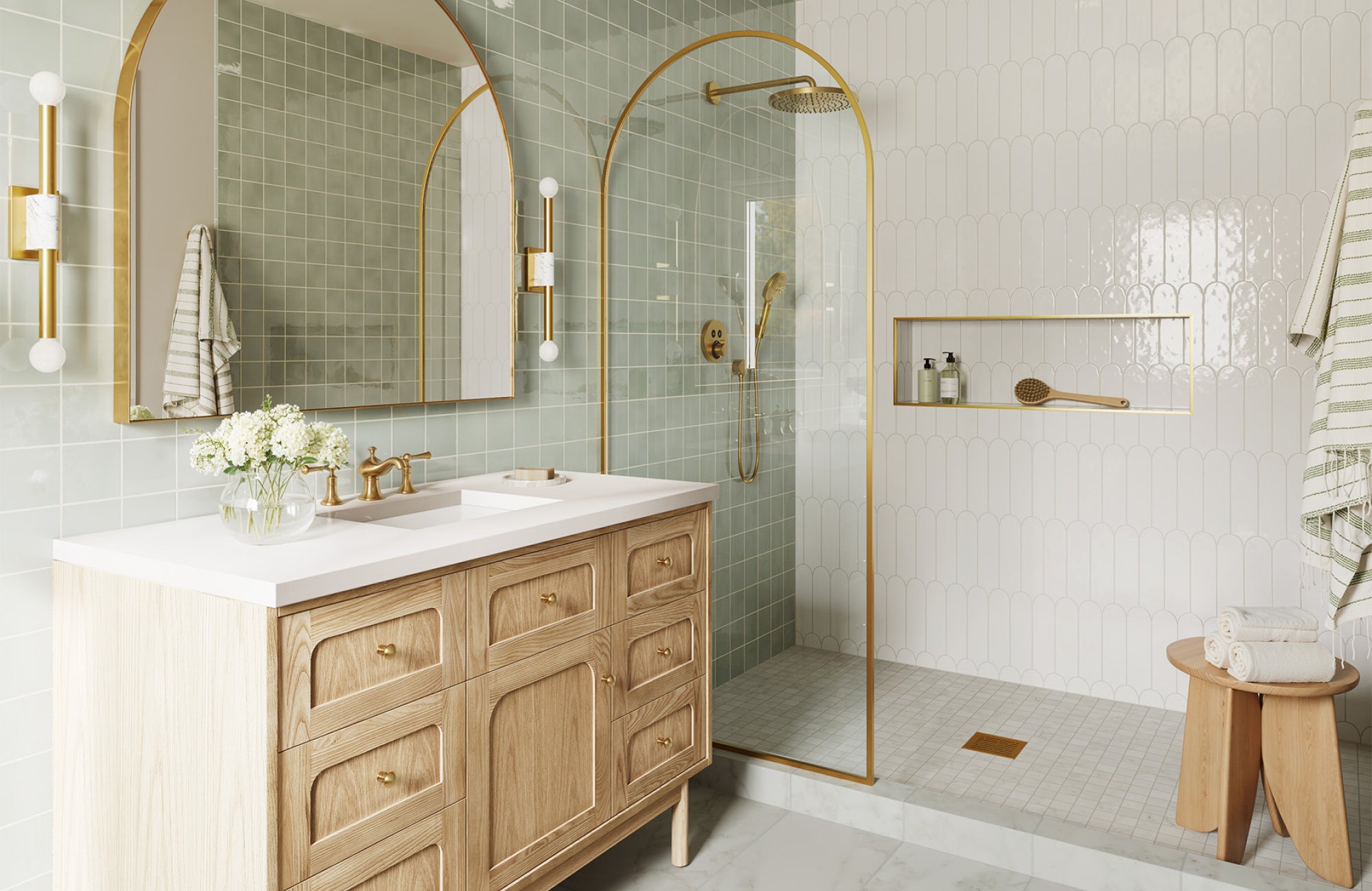 null Light oak bathroom vanity with detailed drawer fronts, gold hardware, and a white top under a large mirror.