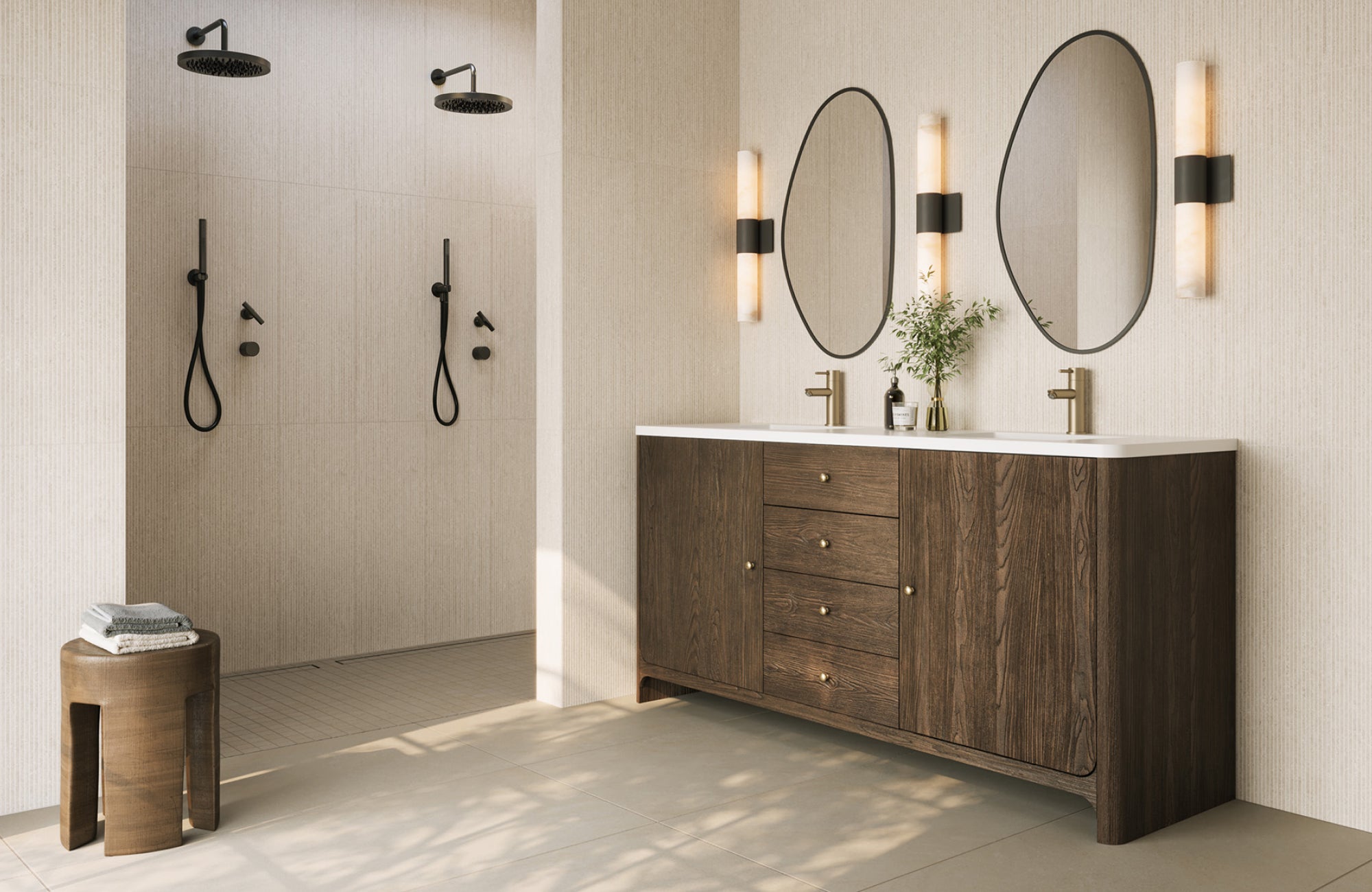 Modern bathroom with two oval mirrors above a dark wood vanity and twin sinks.