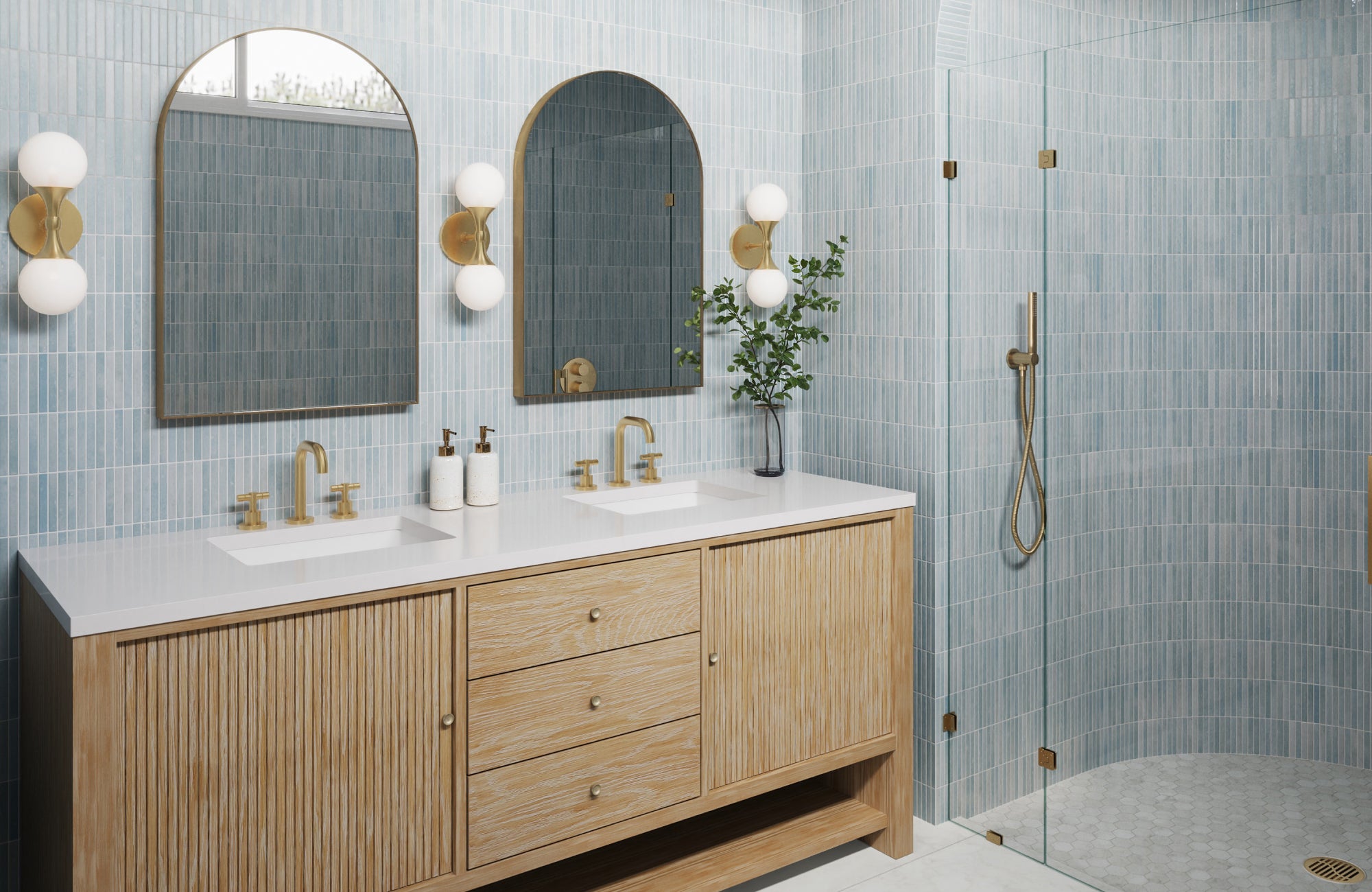 Light blue tile bathroom with two arched mirrors and globe sconces above a double sink.