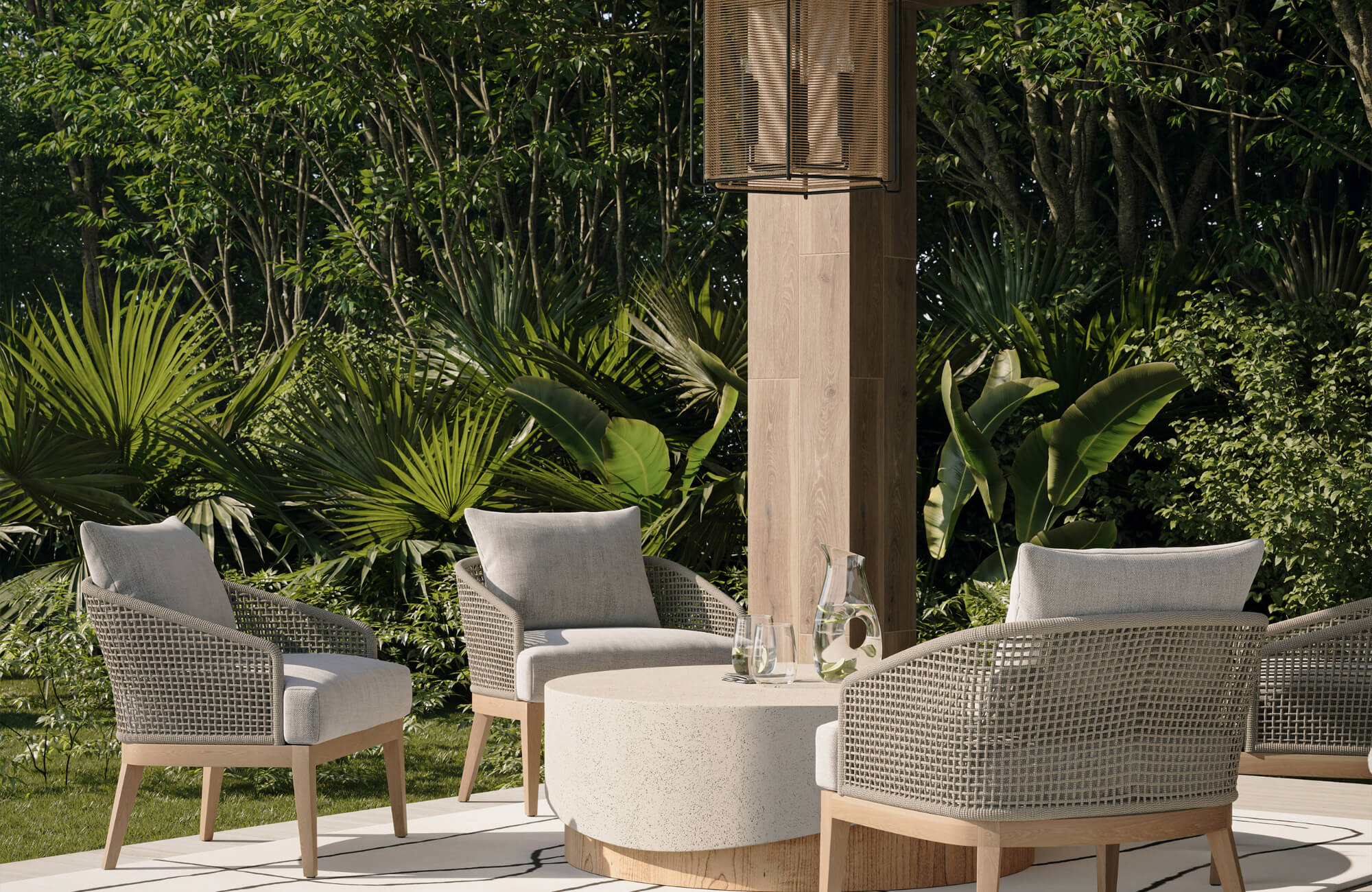 null Outdoor patio seating with woven armchairs, round stone table, and lush greenery creating a relaxed and modern garden setting.