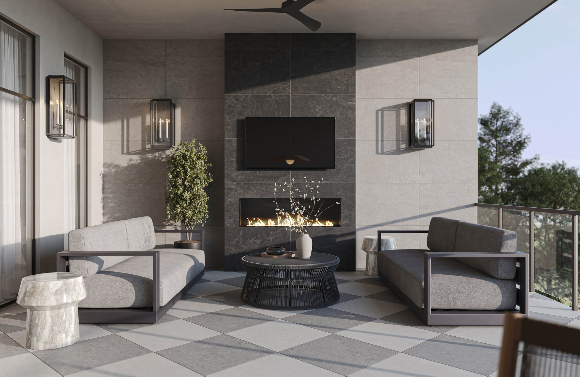 null Contemporary outdoor lounge with neutral sofas, tiled flooring, wall-mounted fireplace, and soft lighting in a covered patio space.