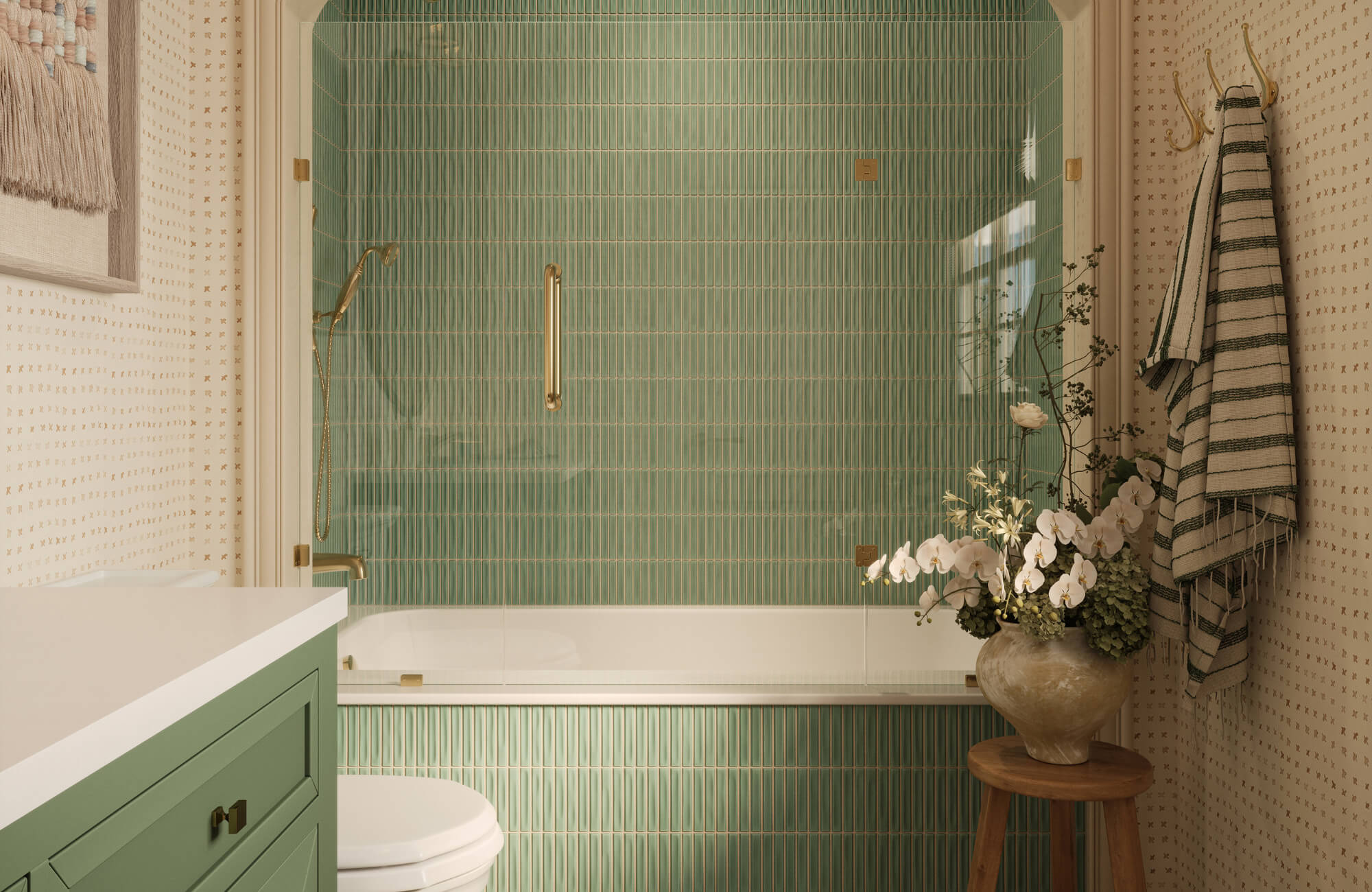 null Bathroom with green vertical tile, glass shower enclosure, brass fixtures, and floral accents creating a fresh and calming space.