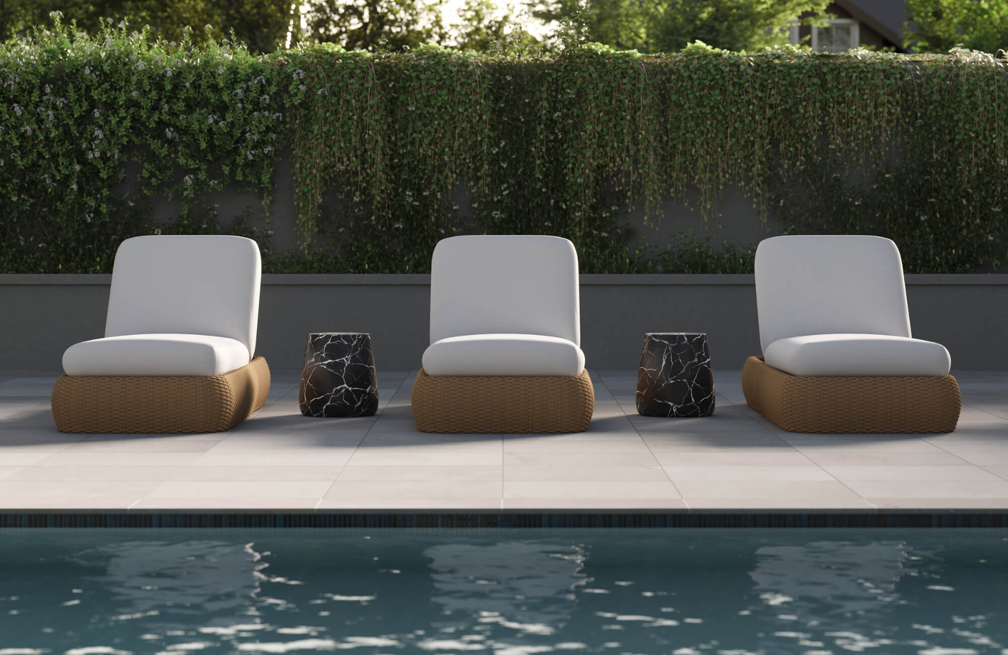 null Poolside lounge chairs with woven bases, white cushions, and modern side tables set against greenery in a serene outdoor retreat.