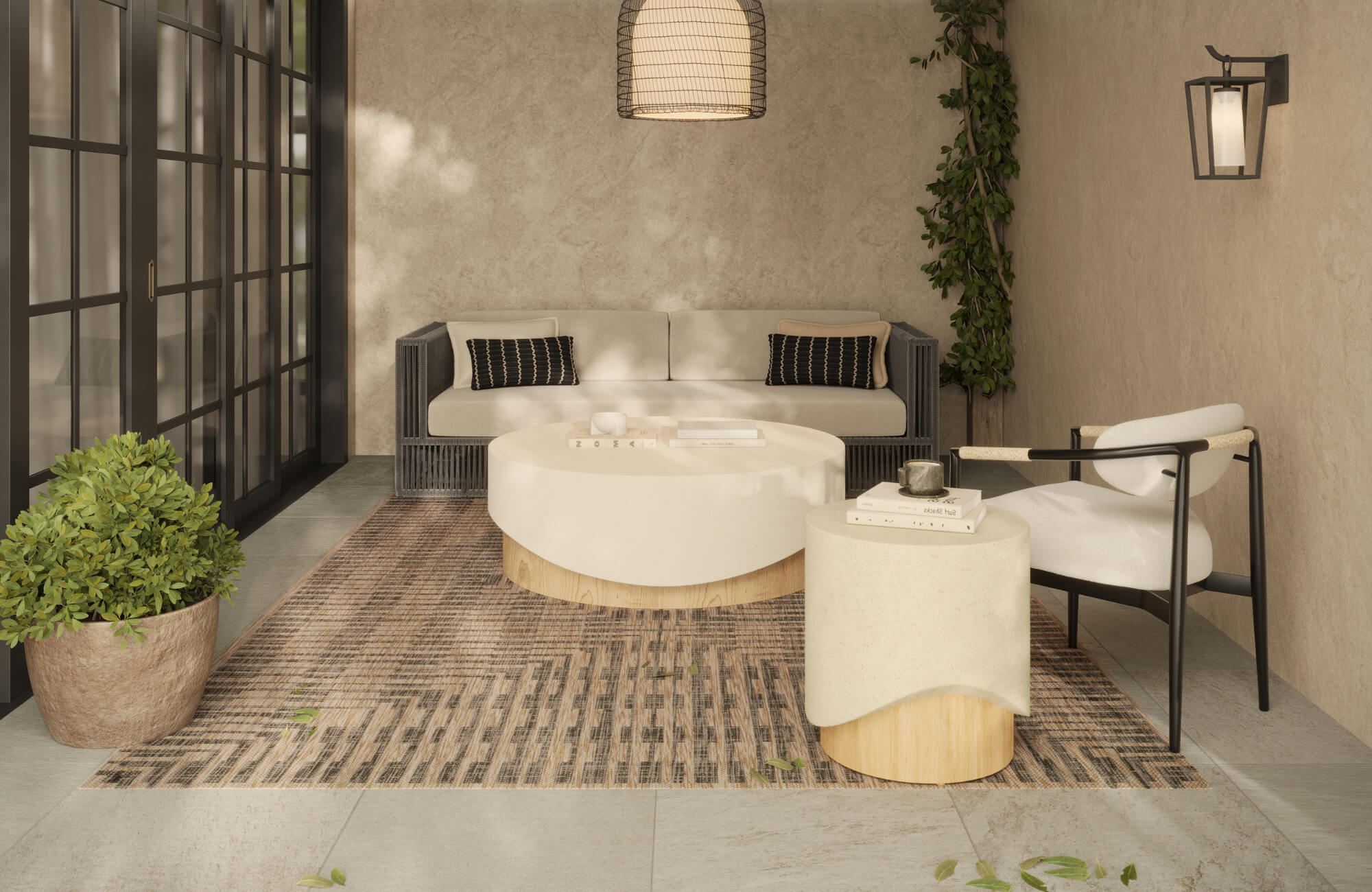 Outdoor patio with patterned polypropylene rug under modern seating, showcasing durability in a warm, sunlit setting.