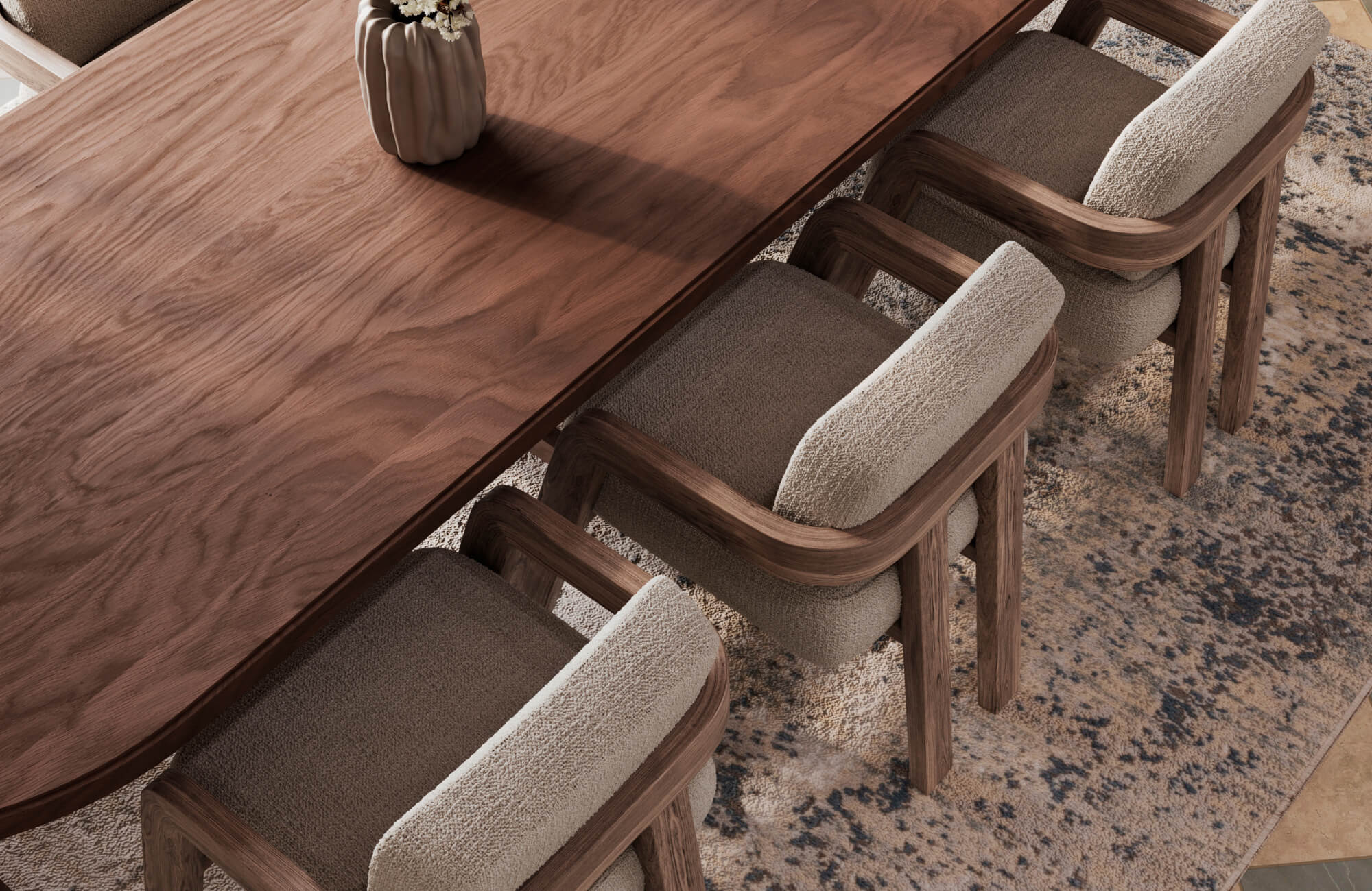 Dining area with wood table and upholstered chairs over a textured polypropylene rug, adding warmth and visual contrast.