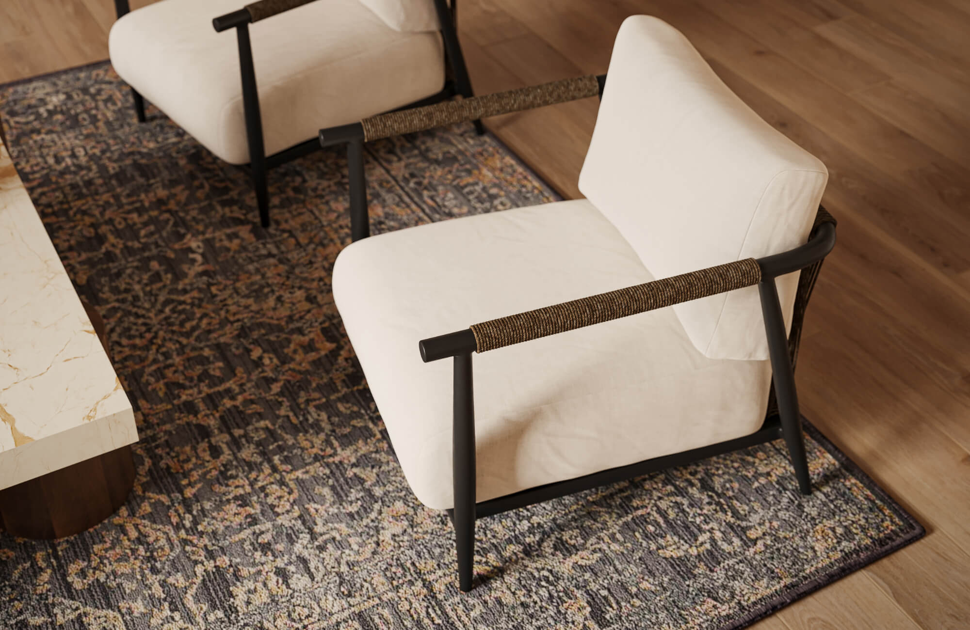 Living space with armchairs placed over a richly patterned polypropylene rug, highlighting color variation and layered texture.