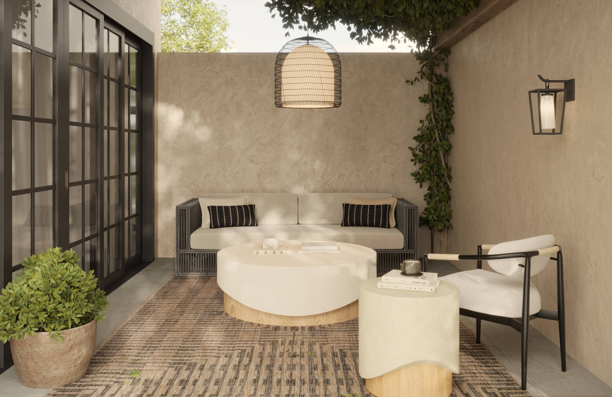 Covered outdoor patio with neutral seating, round coffee tables, woven rug, greenery, wall lantern, and black-framed glass doors.