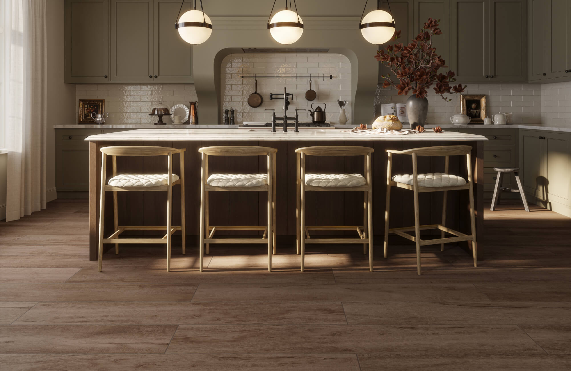 Moody kitchen with dark wood-look tile flooring, a large island, upholstered counter stools, pendant lights, green cabinetry, and a glossy tile backsplash.