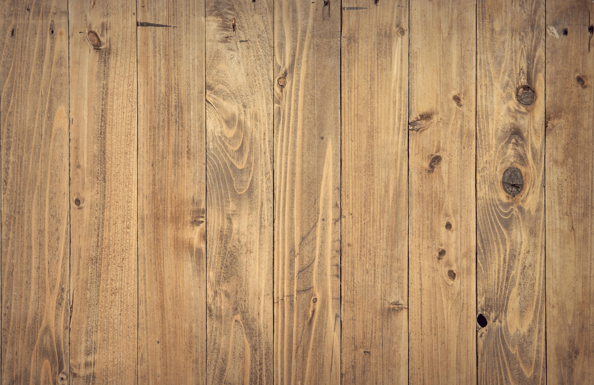 null Close-up of natural wood planks with visible grain and knots, perfect for rustic or farmhouse-inspired interior designs.
