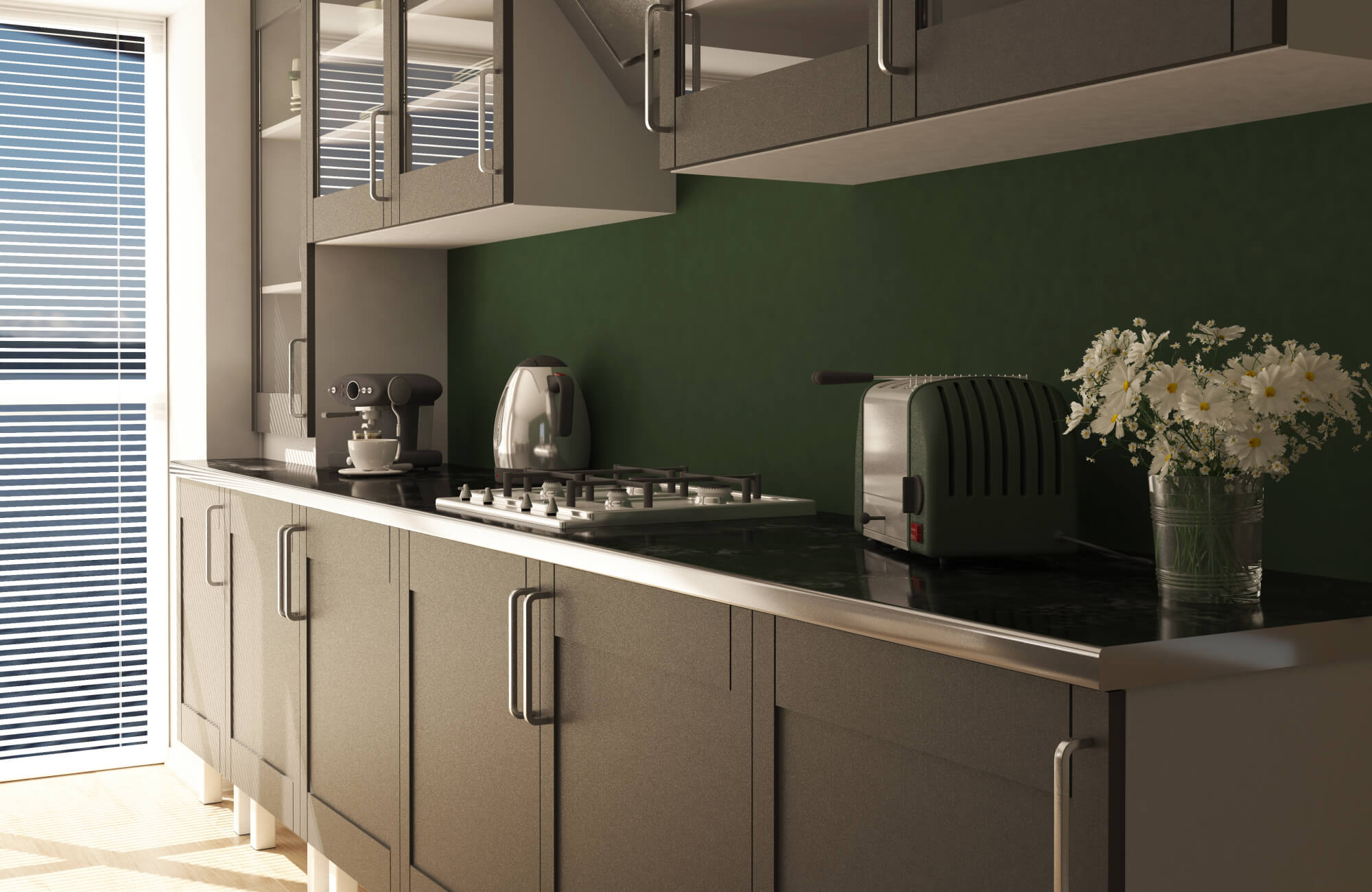 Modern kitchen design featuring matte gray cabinetry, a sleek black countertop with integrated gas cooktop, a rich green backsplash, and thoughtfully styled countertop appliances that add warmth and visual contrast.