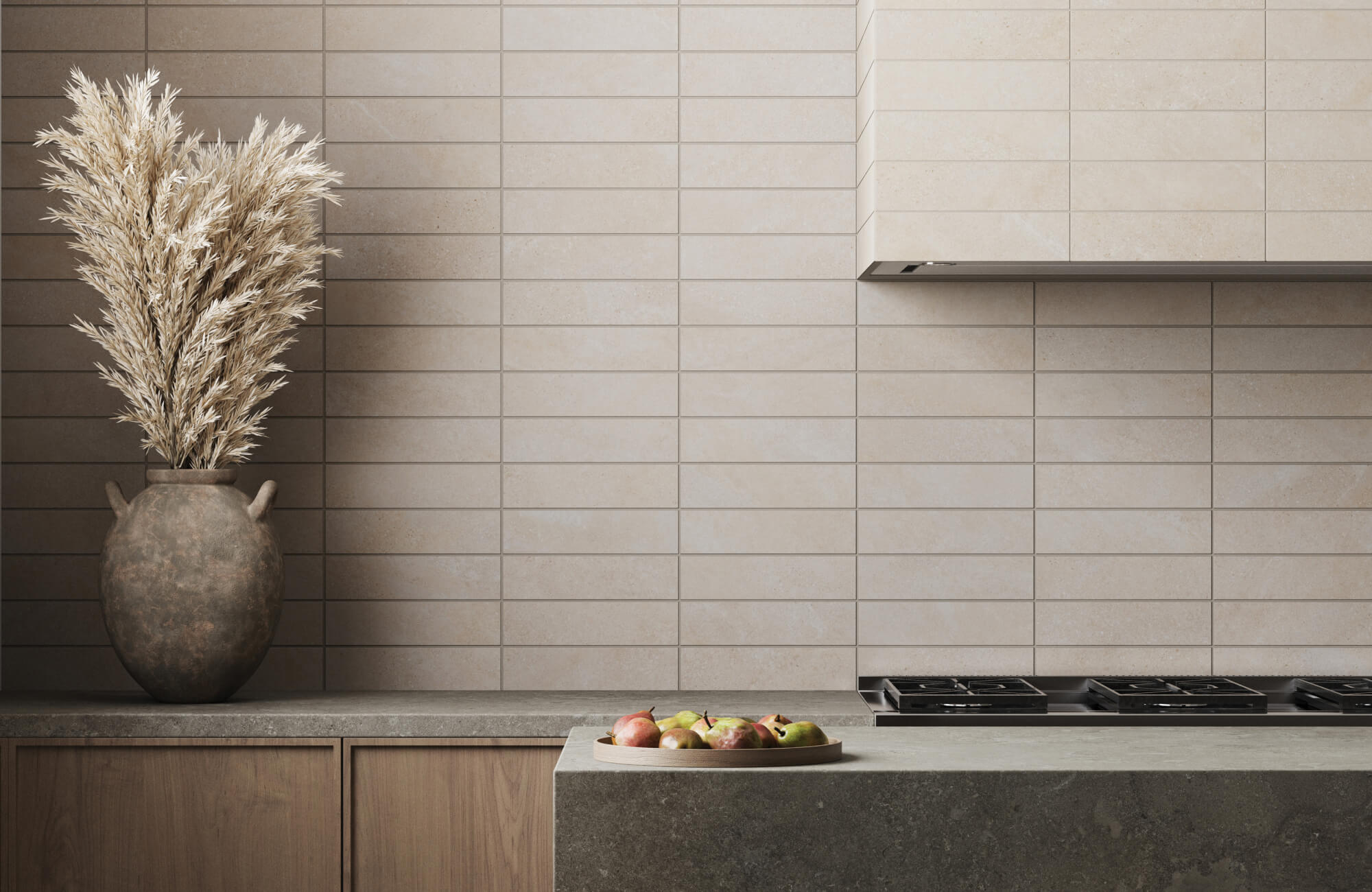 Neutral-toned kitchen featuring beige subway tile backsplash, earthy stone countertops, and a rustic vase with dried pampas grass for a natural touch.