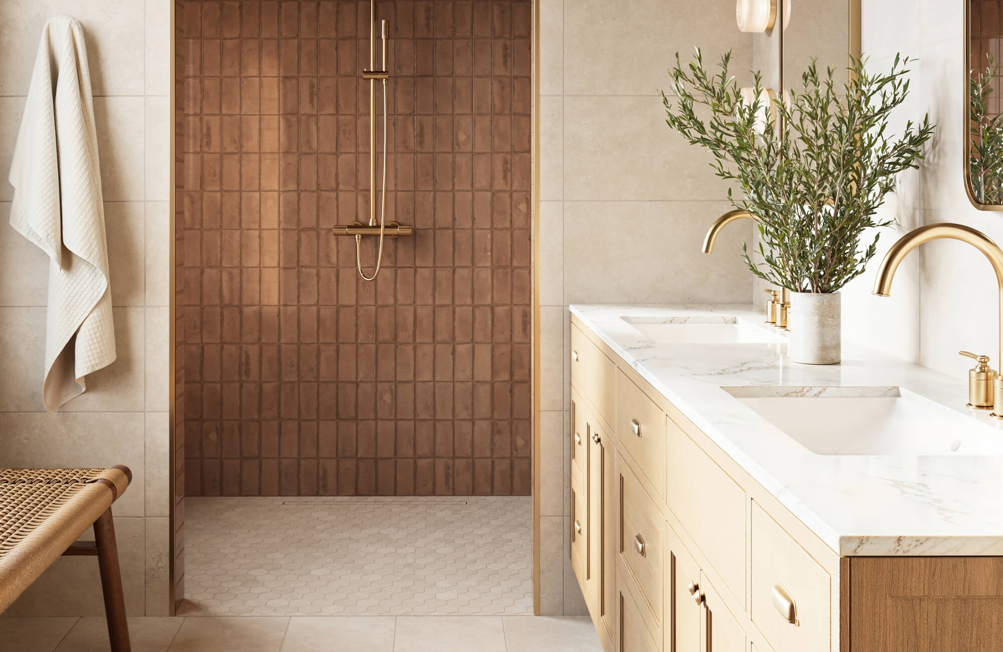 null Elegant modern bathroom featuring warm terracotta shower tiles, soft neutral wall tiles, subtle geometric floor tiles, and brass fixtures paired with clean-lined cabinetry.