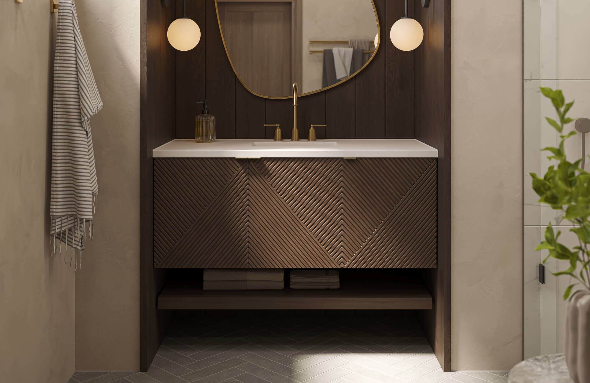 A modern bathroom vanity with rich dark wood cabinetry featuring geometric textured fronts is paired with a crisp white countertop, warm brass fixtures, globe wall sconces, and a round mirror.