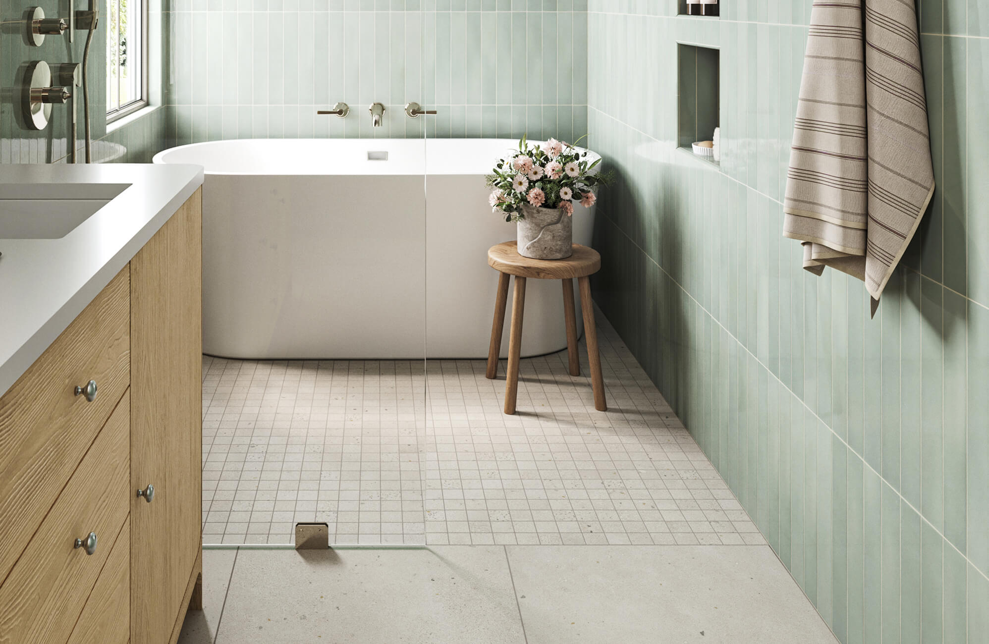 null Modern bathroom with soft green wall tiles and a shower floor of small square mosaic tiles, creating a refreshing and spa-like ambiance.