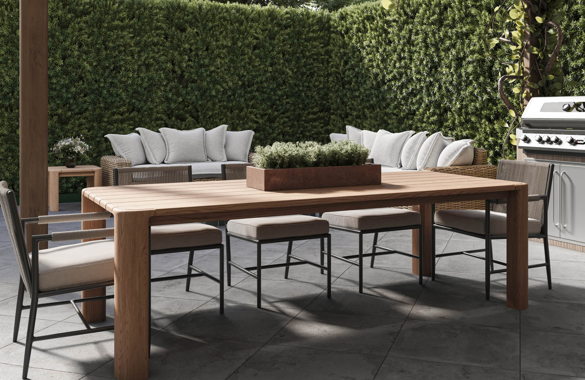 null A spacious patio dining arrangement showcases a wood dining table paired with cushioned chairs, framed by manicured hedges and a nearby outdoor kitchen.
