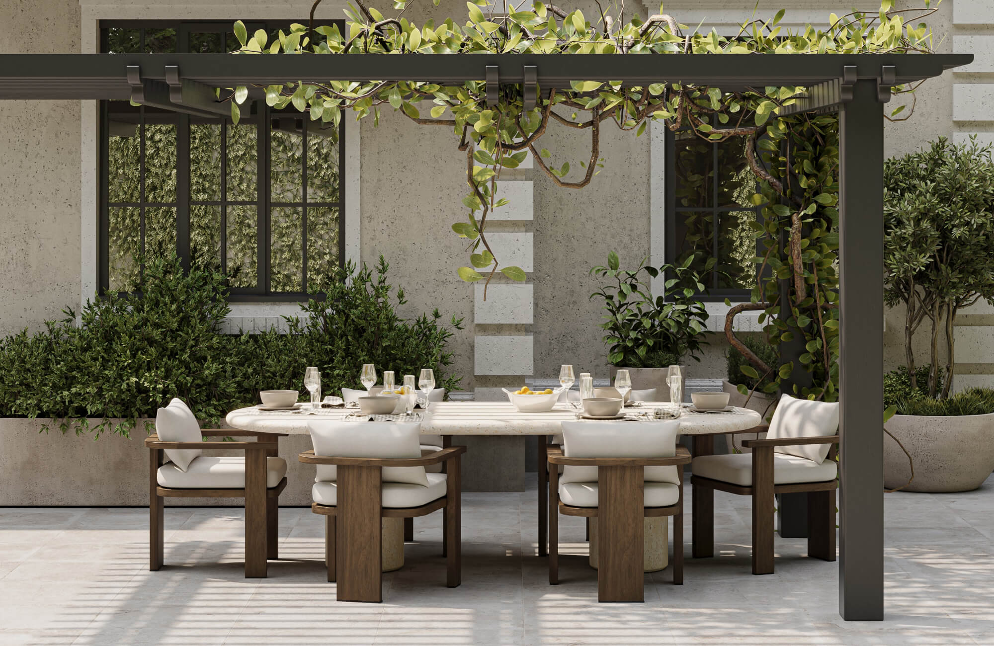 null A covered dining area beneath a vine-draped pergola creates filtered shade around a generously sized table surrounded by cushioned armchairs and lush planting beds.