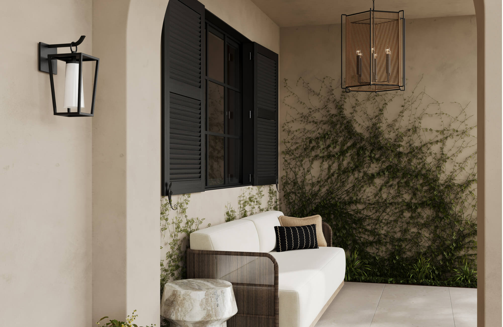 Inviting outdoor house lighting with a wall-mounted lantern sconce and a hanging cage-style pendant softly illuminates this covered porch, accentuating the arched architecture, lush greenery, and cozy seating nook.