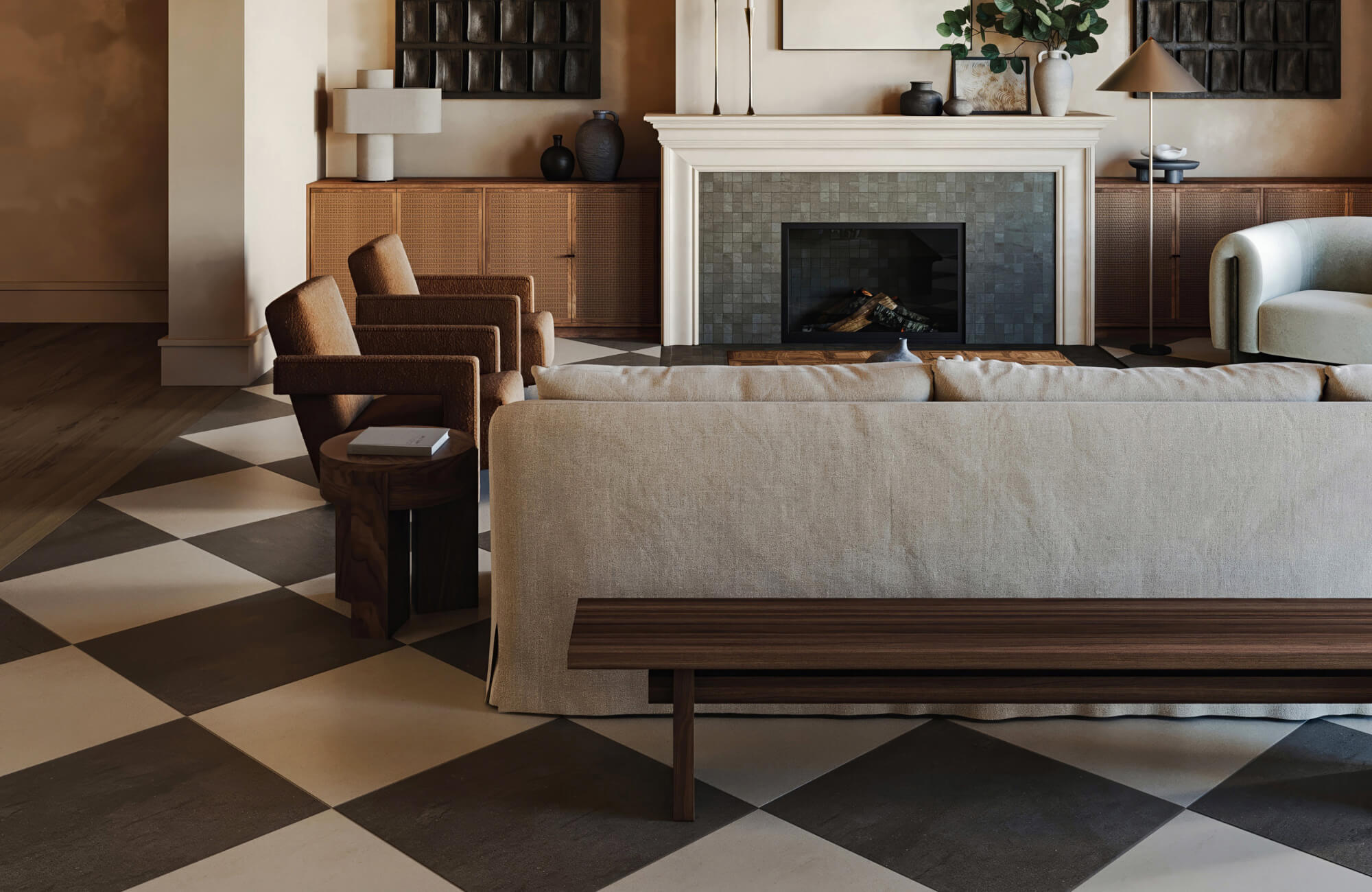 Warm-toned living room with taupe and charcoal checkerboard tile flooring, neutral furniture, and a tiled fireplace with wood accents.