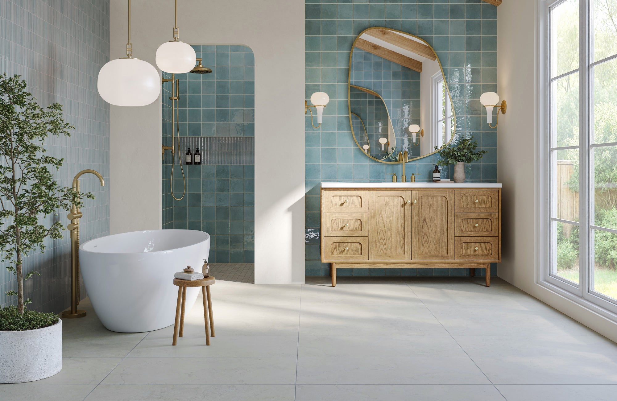 Asymmetrical mirror floating over single sink vanity with blue tile wall and curved ceiling detail.