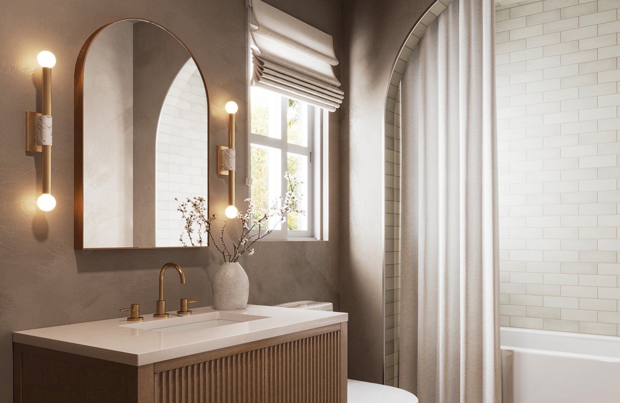 Rounded arch mirror above compact sink vanity with globe sconces and curved shower curtain in cozy setting.