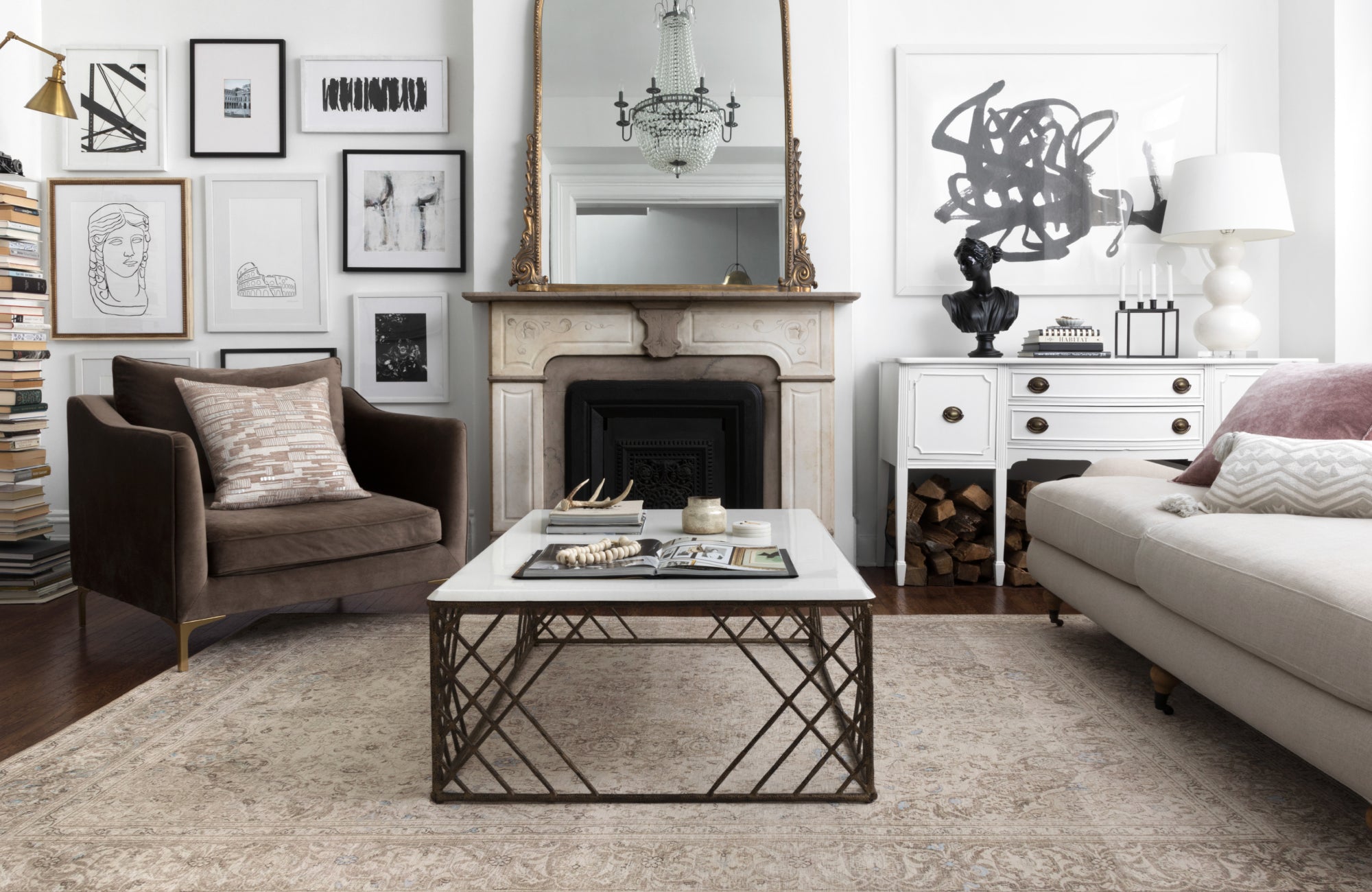 Pale rug pattern echoes wall art and trim for a balanced, cohesive look without direct color matching.