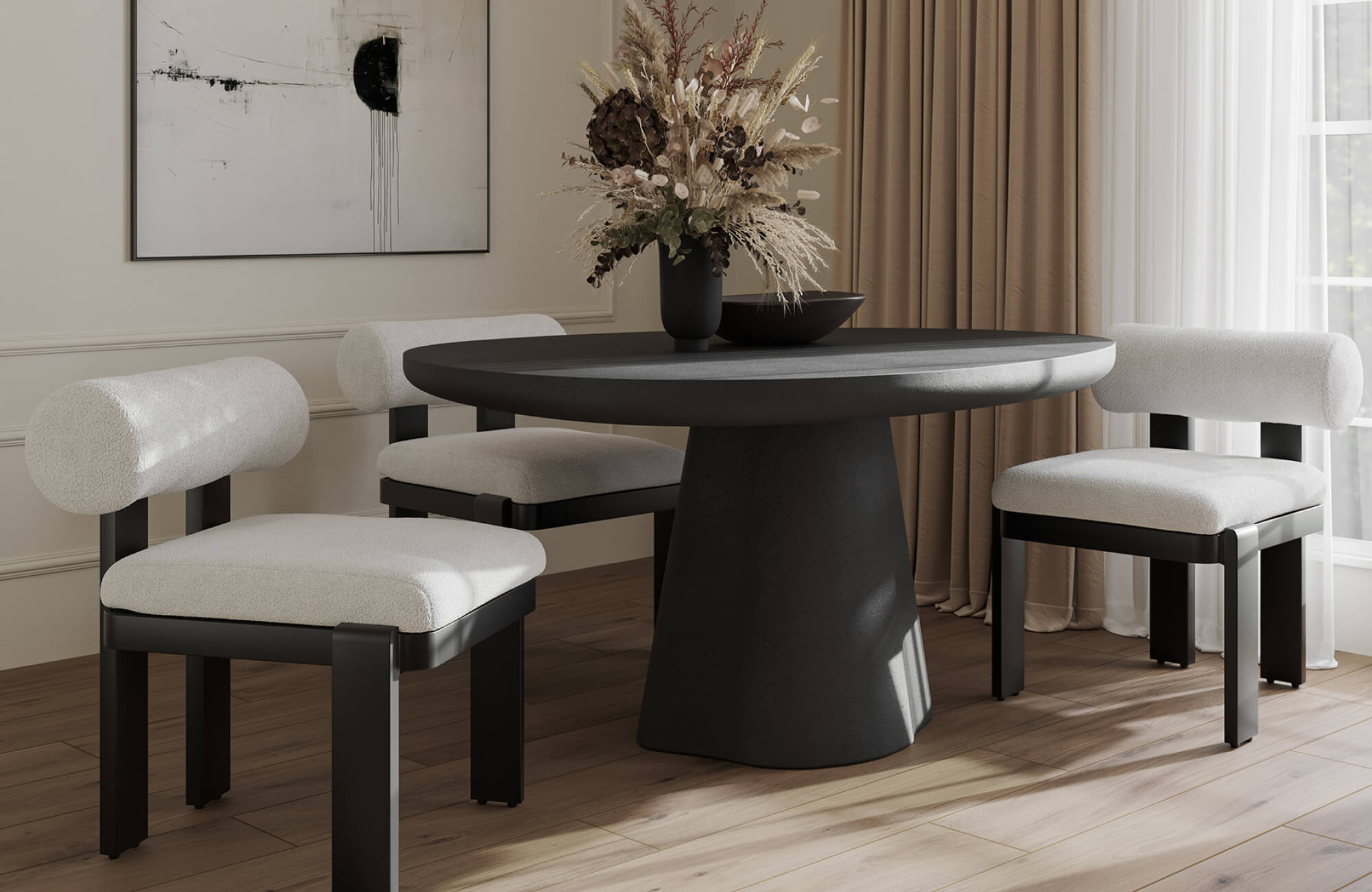 Light upholstered dining chairs paired with a sculptural dark table, balancing visual weight with a soft, open seating feel.