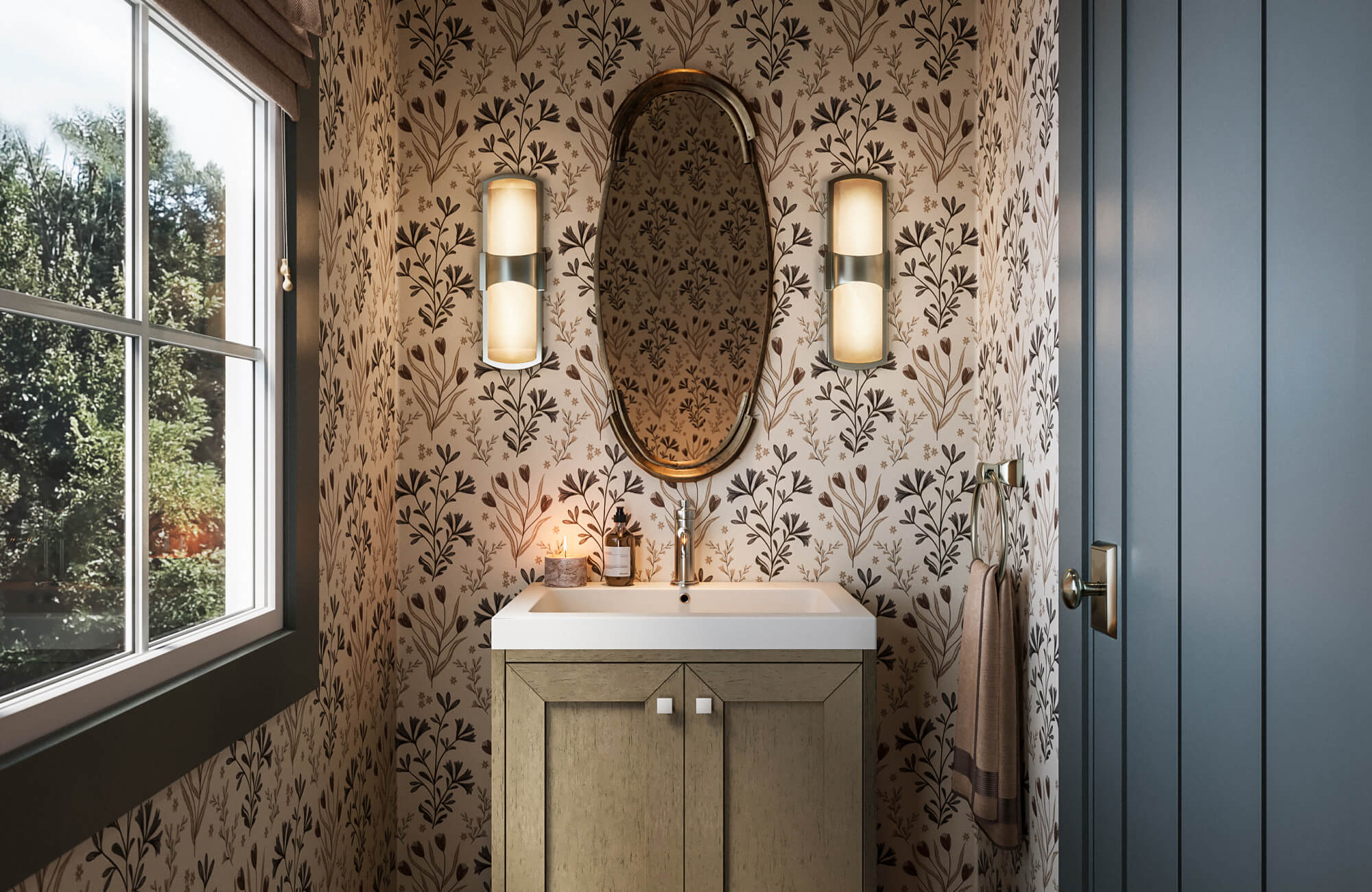 Charming powder room with delicate floral wallpaper, oval mirror, warm sconces, and a light wood vanity for a cozy feel.