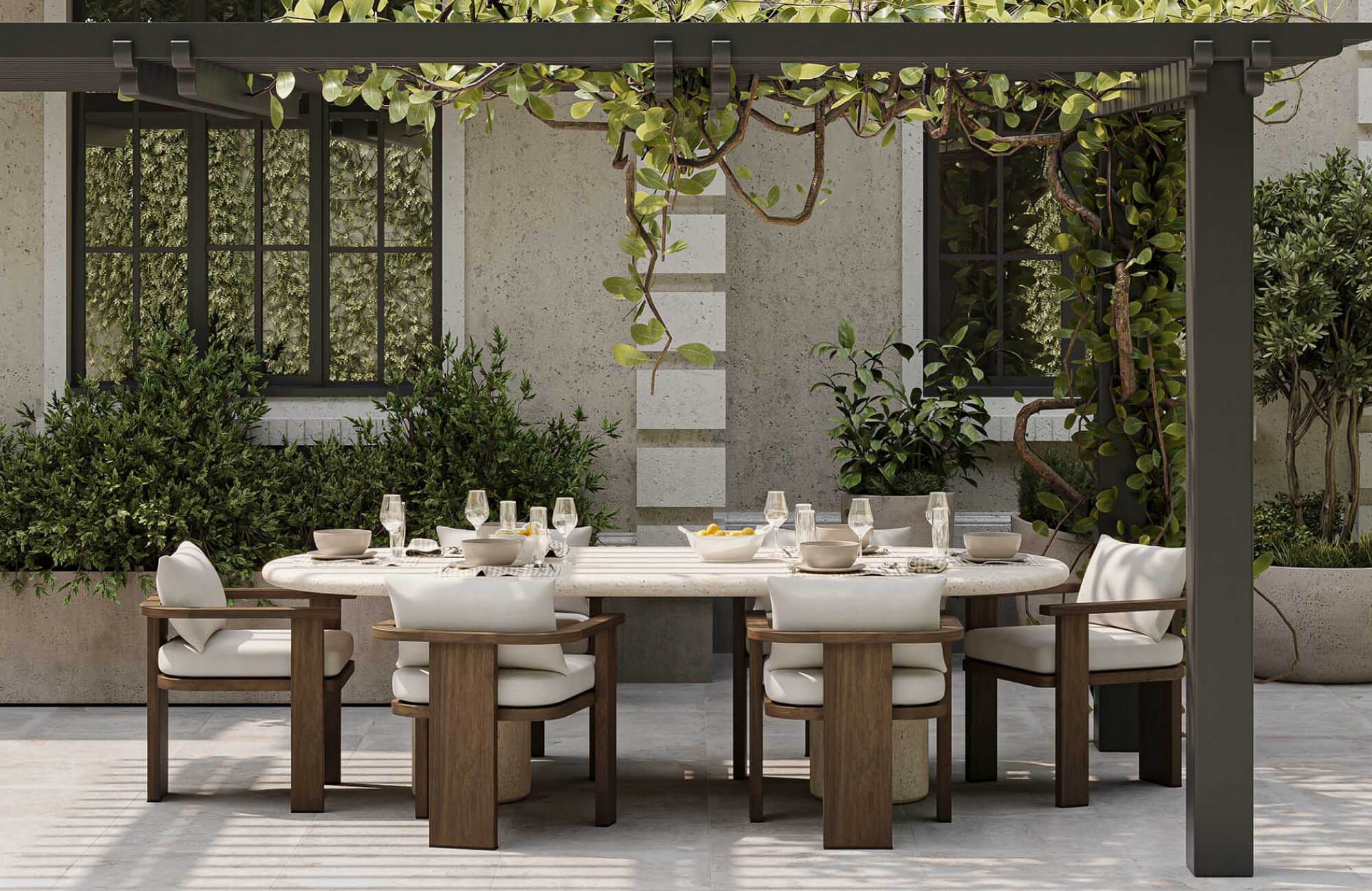 Elegant pergola dining area with wood chairs, concrete table, and lush vines, grounded by a gray patio tile flooring.