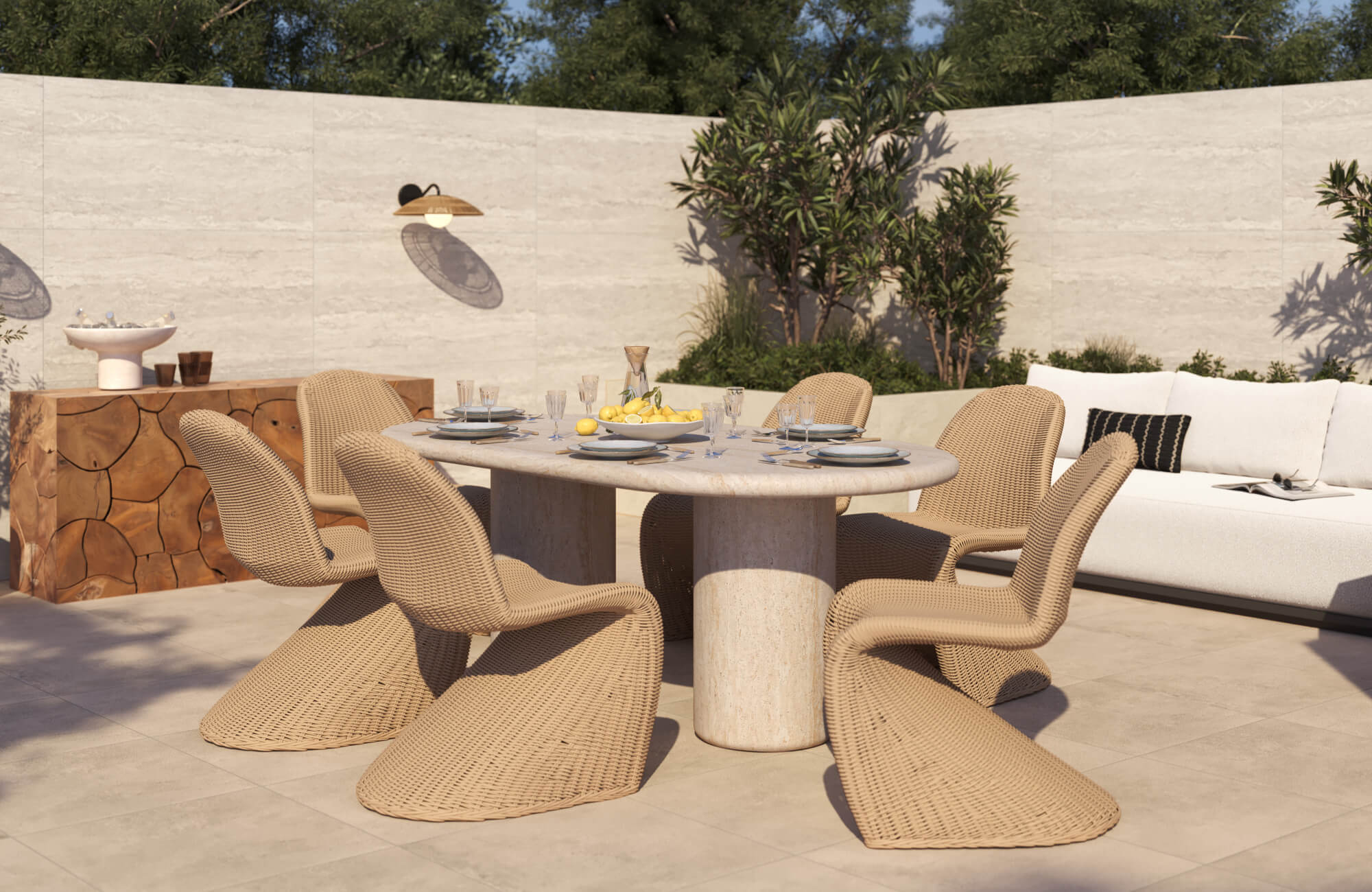 Sunlit outdoor space with oval table, and woven outdoor dining chairs, grounded by a beige floor tile.