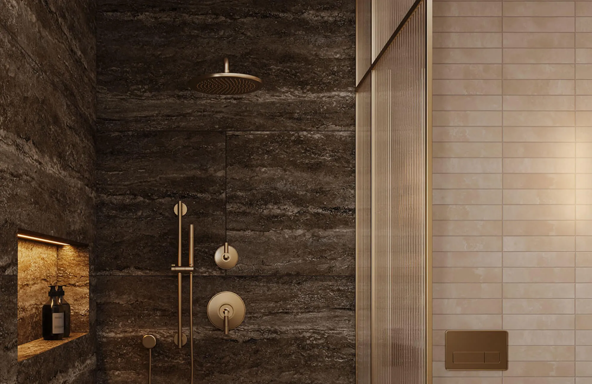Dark stone-look shower tiles with warm brass fixtures create a dramatic, enclosed shower space with rich texture and depth.