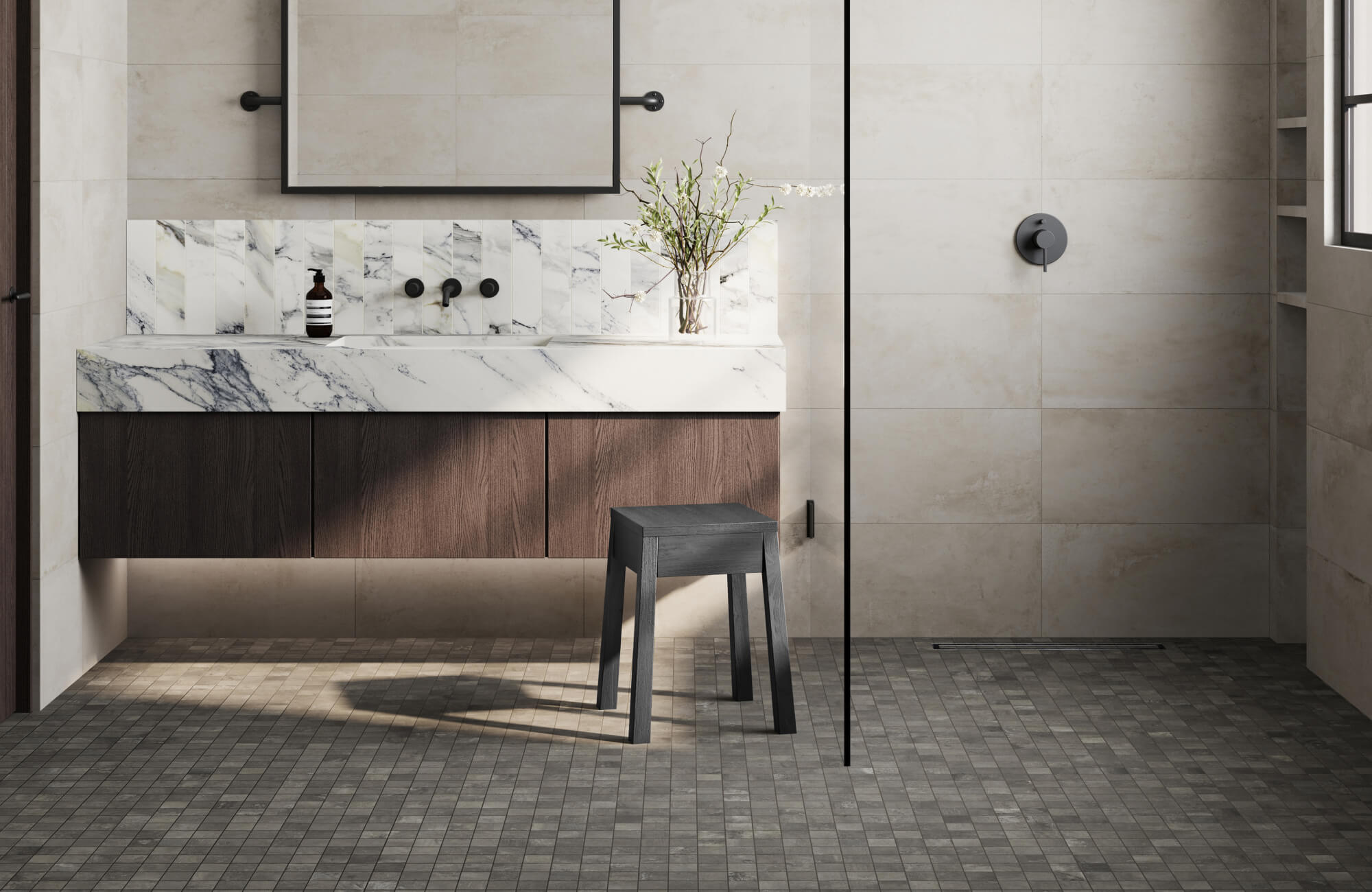 null Dark gray small-format bathroom floor tiles extending across a walk-in shower and vanity area create a cohesive, grounded look that enhances depth and practicality.