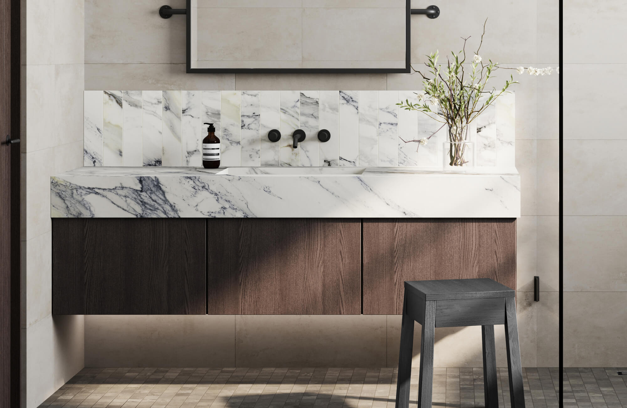null Floating vanity with rich wood cabinetry and bold Calacatta marble sink, paired with vertical marble tiles and matte black fixtures.