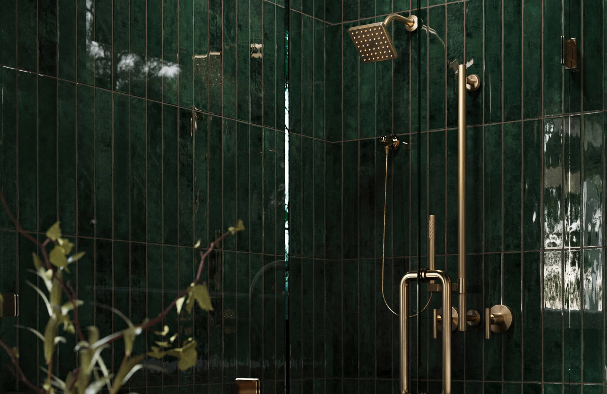 null Rich emerald green tiles installed vertically wrap this shower, paired with warm brass hardware for a dramatic, spa-like mood that emphasizes height.