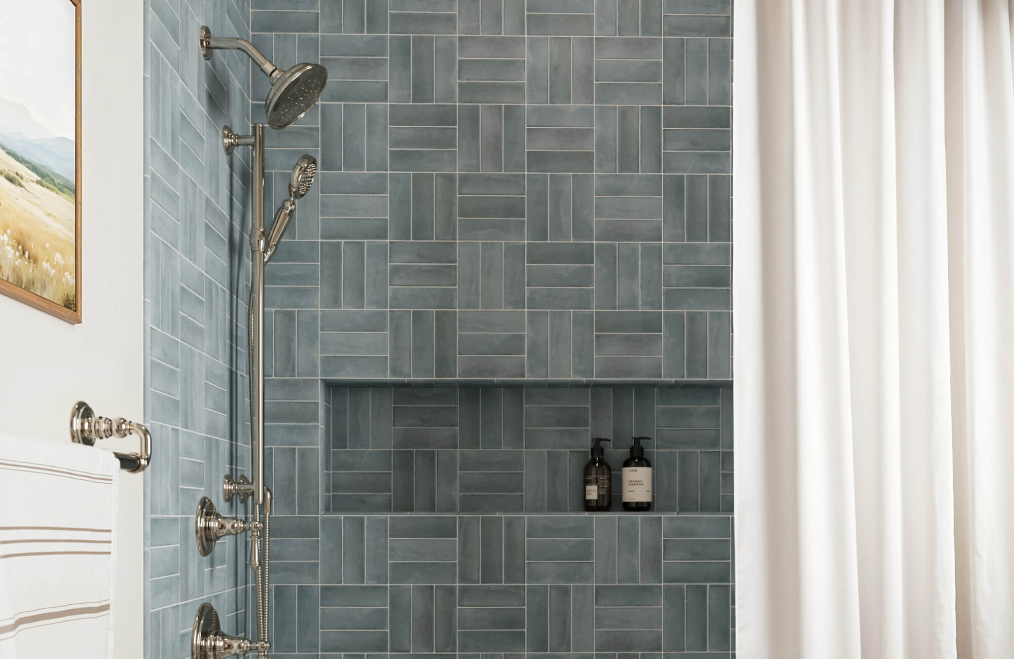 null A mix of horizontal and vertical blue tiles forms a subtle grid, creating visual interest while keeping the space calm and balanced.