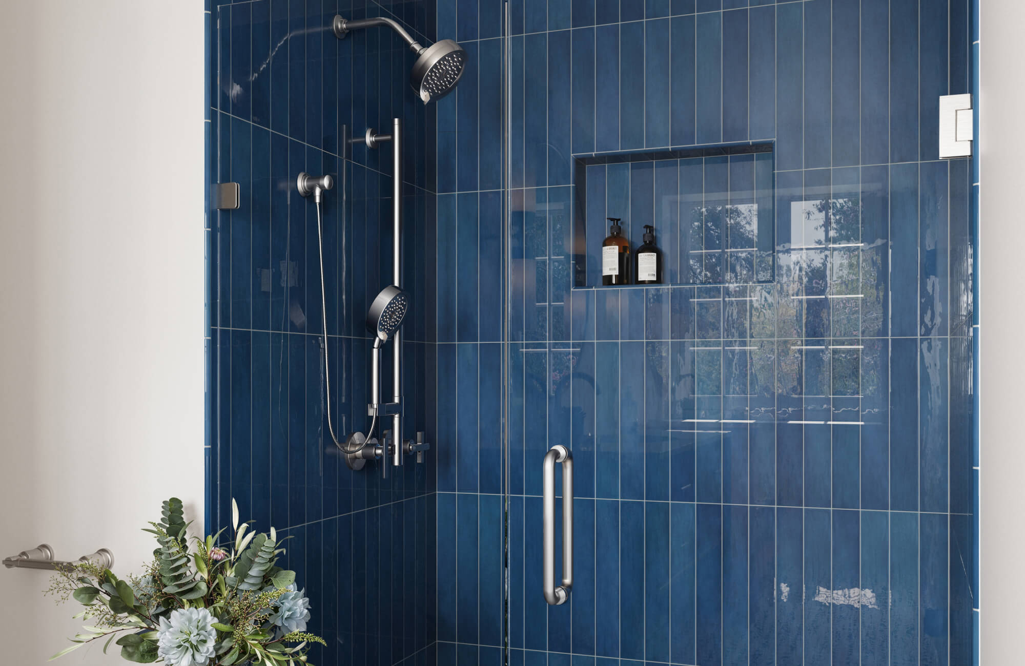 null Deep blue vertical tiles draw the eye upward, making the shower feel taller while creating a bold, immersive mood with a glossy, reflective finish.