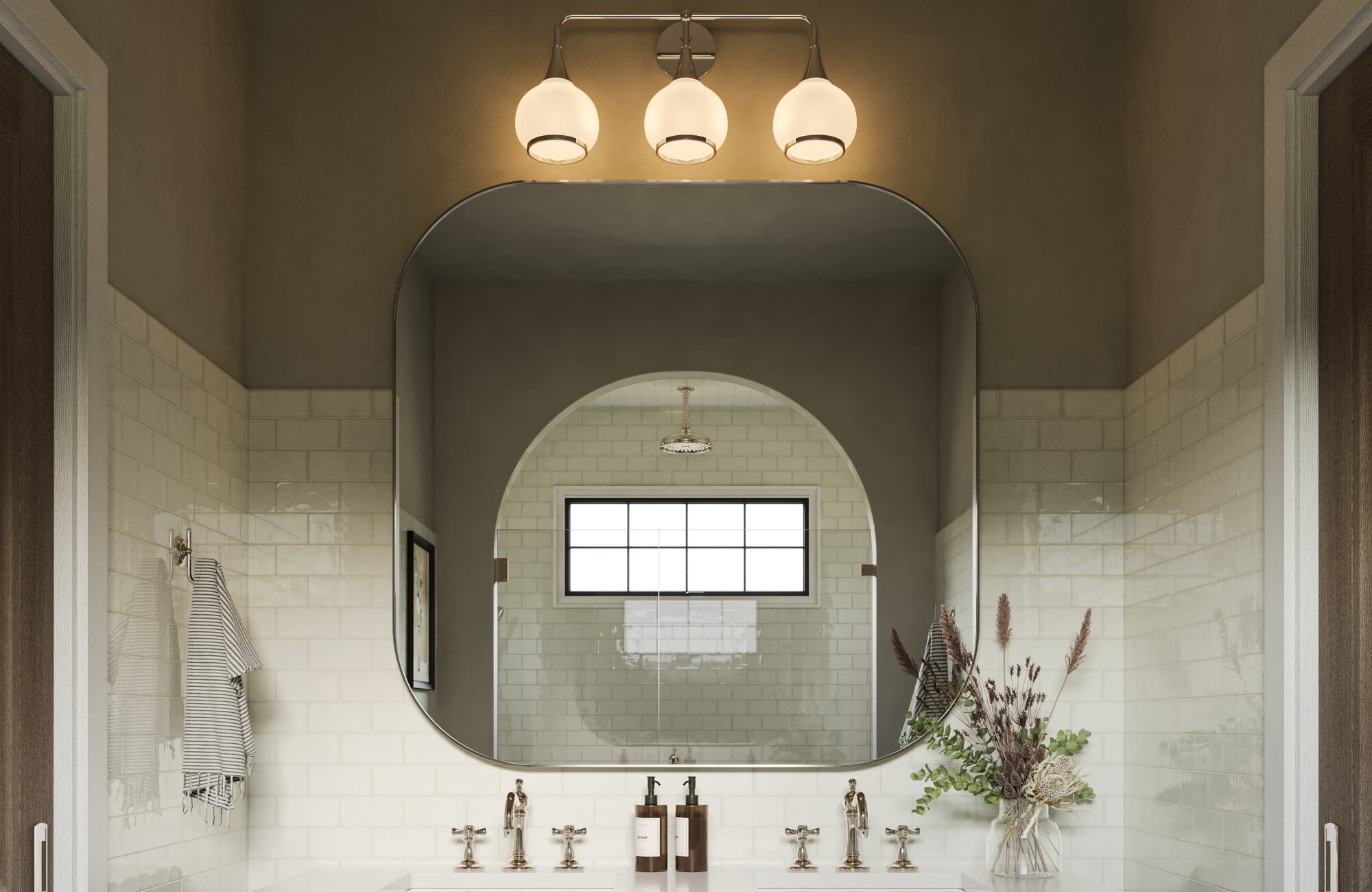 null Timeless bathroom with arched mirror, triple globe vanity light, subway tiles, and polished chrome fixtures.