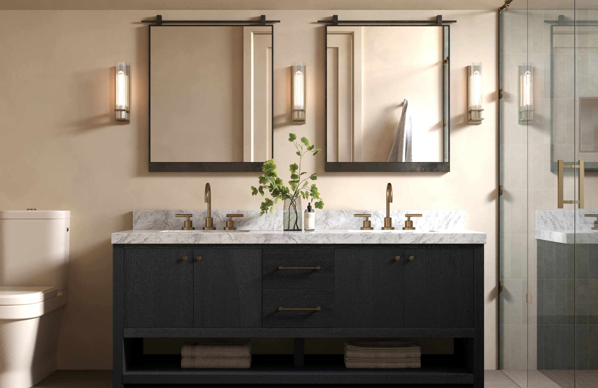 Elegant bathroom vanity with twin black framed mirrors, brass fixtures, and a marble countertop against warm beige walls.