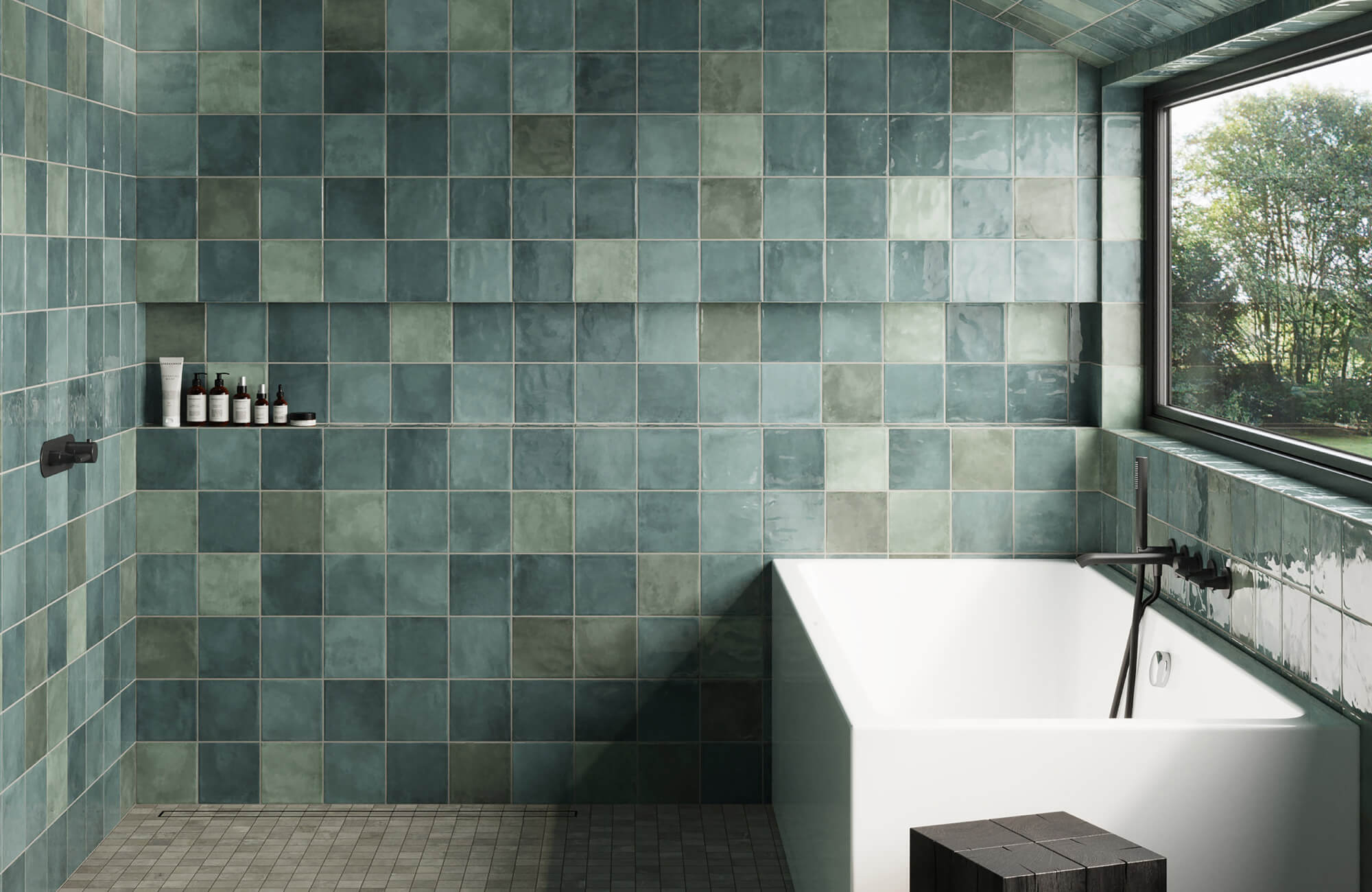 null Bathroom with teal square tiles covering the tub and shower walls, a recessed shelf, black fixtures, and a window beside the bathtub.