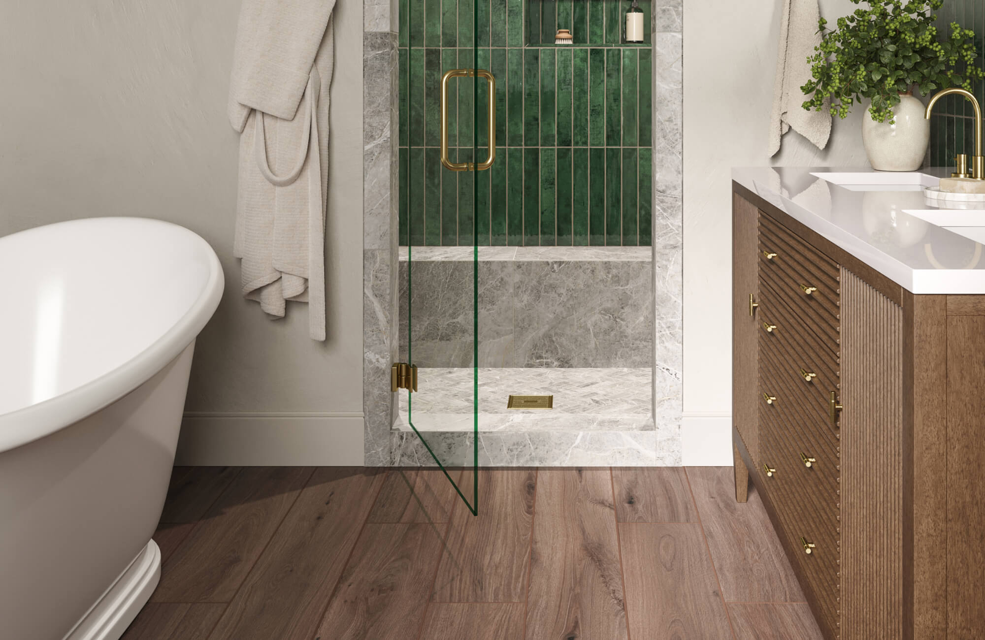 Inviting bathroom featuring warm wood look floor tiles paired with a green tiled shower and brass fixtures, creating a rich, organic aesthetic that blends modern luxury with natural warmth.