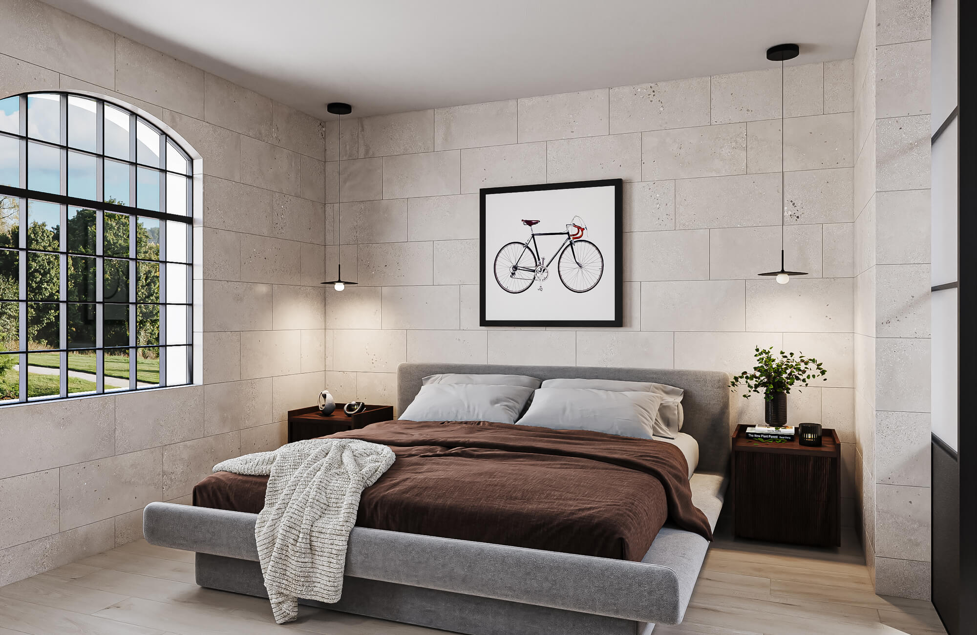 Modern bedroom with a gray upholstered bed, white pillows, brown bedding, pendant lights, and large neutral wall tiles surrounding an arched window.