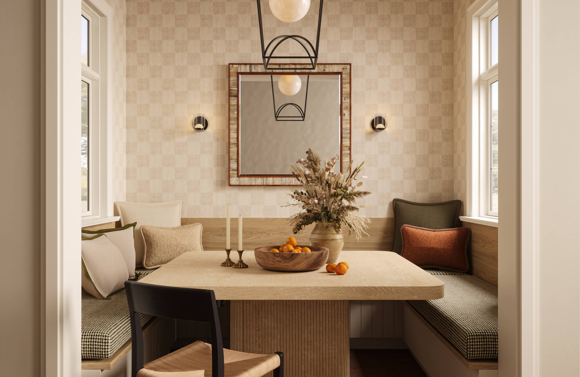Small dining nook with a square wood table, built-in benches, patterned cushions, pale wallpaper, a wall mirror, and a hanging globe light.